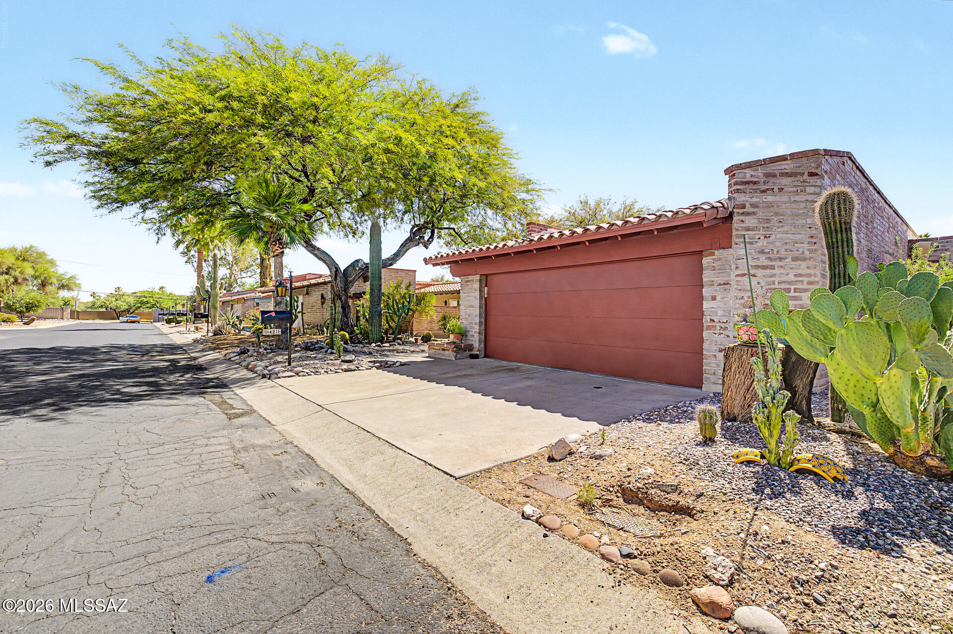 Beautifully crafted burnt-adobe home in Northwest Tucson offering timeless Southwestern character and a comfortable single-level layout. This 3-bedroom, 2-bath residence features a spacious living area with a gas fireplace, large ceramic tile floors throughout, and an inviting eat-in kitchen with ample storage and newer appliances. The generous primary suite includes a walk-in closet and private bath. Enjoy low-maintenance desert landscaping, a covered patio, and a walled backyard ideal for outdoor living. Located in a well-kept community with mature foliage and access to a pool, spa, and tennis courts, this home blends classic adobe construction with everyday functionality in a peaceful, convenient setting.

Community amenities include a resort-style swimming pool and tennis courts.