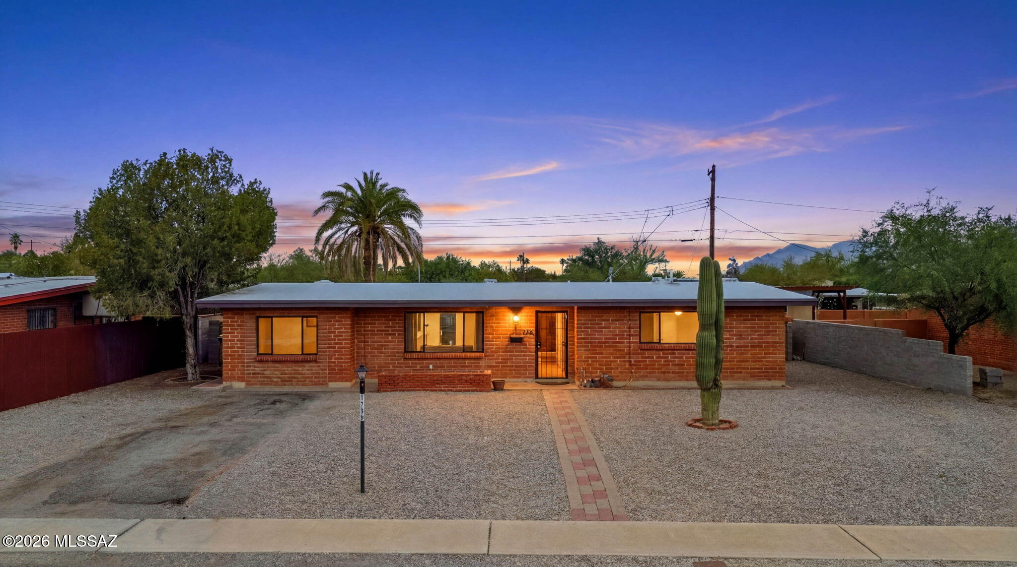 What is it about a classic brick home on Tucson's west side that feels so timeless? This one answers that question the moment you arrive. With views of Tumamoc Hill right out front, this cute and well-kept home sits tucked into an established neighborhood near Pima Community College West Campus, downtown Tucson, hiking trails, and easy freeway access.

Inside, you'll find 2 bedrooms, 1 bathroom, and 1,064 sq ft with a comfortable layout, natural light throughout, and an inviting feel the moment you step inside. The attached garage was enclosed, creating additional bonus space not included in the stated square footage. This flexible area can function as a second living room, office, hobby space, workout room, or potential guest area depending on your needs. The backyard offers a detached garage and plenty of space to enjoy Tucson evenings, whether gardening, entertaining, or simply taking in the desert surroundings. This home carries a rare kind of character that's getting harder to find: simple, charming, and full of possibility.