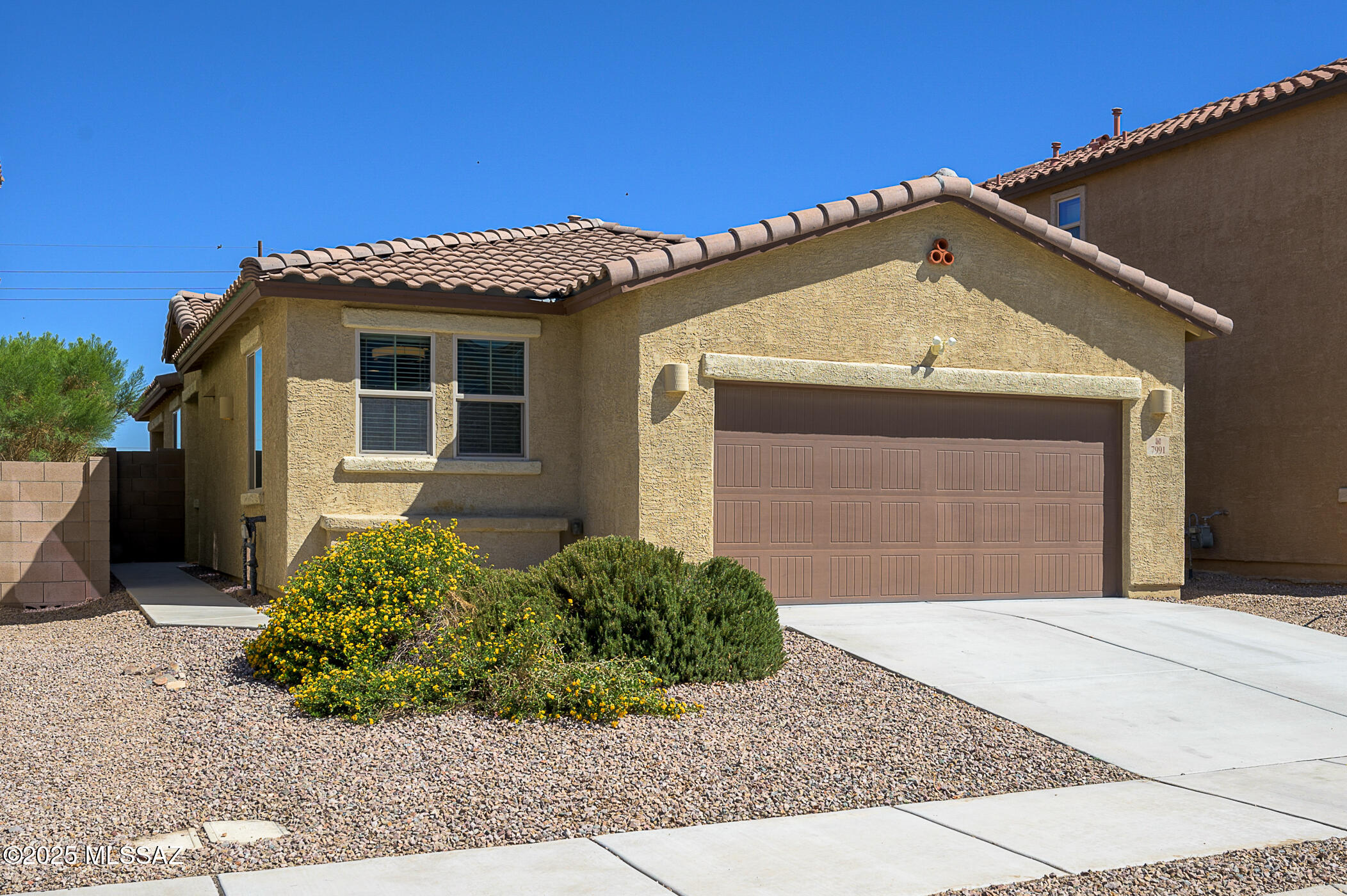 This is the nearly new, well maintained home you've been waiting for!  Step inside to vaulted ceilings and a gourmet kitchen featuring a 5-burner gas cooktop, double oven, upgraded cabinetry, and ample counter space. Home features PAID OFF solar panels to keep monthly costs low, and decorative custom steel doors at front and patio.  

Relax or entertain in the beautifully landscaped backyard, complete with paver patio, low-maintenance turf, and a built-in BBQ/cooktop — perfect for Arizona evenings. Thoughtful upgrades everywhere and all appliances included: new dishwasher, brand new washing machine, dryer, stainless refrigerator.  

All this and located within the award-winning Vail School District, close to DMAFB, and home has 2.9% assumable VA loan!