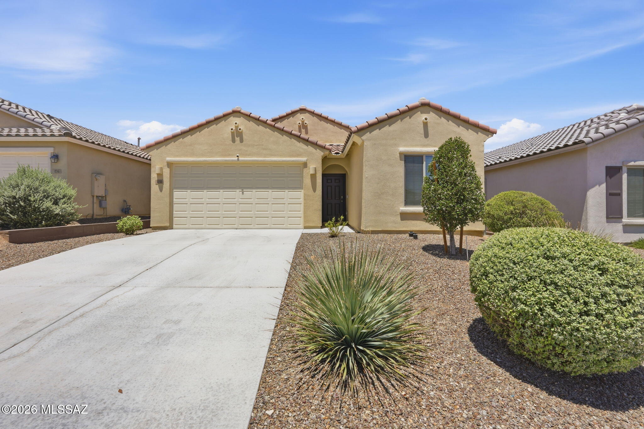 Priced to sell, this like-new 3-bedroom Centex home offers all the benefits of new construction at a more affordable price. Ideally located in the heart of Sahuarita, you are just minutes from shopping, restaurants, schools, parks, and everyday conveniences. The family-friendly community offers outstanding amenities including multiple pools, a water park, volleyball and basketball courts, tennis, a fitness center, and a lake, creating endless opportunities for recreation and fun. Low-maintenance landscaping enhances the curb appeal while giving you more time to enjoy life instead of yard work. The two-car garage protects your vehicles from the elements and provides convenient direct access into the home. Designed with a desirable split-bedroom floorplan, the primary suite is thoughtfully separated from the two guest bedrooms, offering privacy and personal space for everyone. The open great room concept keeps everyone connected, whether relaxing in the spacious living area, gathering around the kitchen, or sharing meals in the dining space. Large windows fill the home with natural light, while the expansive living room easily accommodates a large sectional for movie nights and everyday comfort. The kitchen is beautifully appointed with granite countertops, a center island with breakfast bar, stylish cabinetry, pantry storage, and stainless steel appliances, making it the perfect space for everything from quick meals to entertaining family and friends. The adjacent dining area easily fits a large table and offers easy access to the backyard for seamless indoor-outdoor living and weekend BBQs. Both the en-suite primary bath and guest bath feature cultured marble countertops and large mirrors, while spacious closets with organizers provide excellent storage. The large laundry room includes like-new washer and dryer along with additional storage space. Built with energy efficiency in mind, this home features a gas tankless water heater and solar to help maximize savings. The large backyard is fully enclosed by block walls and backs to a common area for added privacy, offering a blank canvas to create your own outdoor oasis. This is an incredible value you do not want to miss.