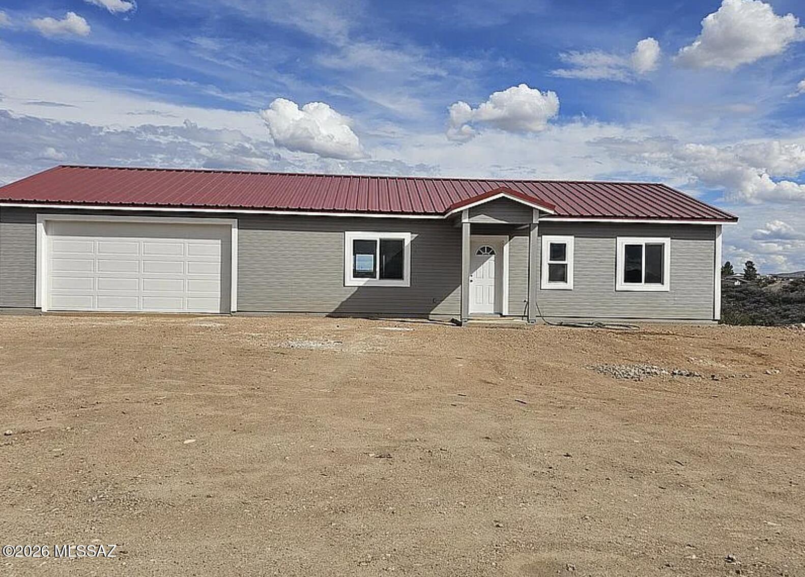 Tombstone's Best Buy in New Construction! Built by Uscio Builders, this beautifully upgraded home offers quality craftsmanship and modern comfort throughout. Featuring 2 spacious primary suites, 2 bathrooms, custom closets, 9-foot ceilings, durable 2x6 construction, a 40-year metal roof, and energy-efficient Milgard windows with a lifetime warranty. The open floor plan includes an electric fireplace, central A/C, and all stainless-steel appliances. Situated on a level lot with RV parking and hookups, plus an oversized 24x30 two-car garage with plenty of room for vehicles, storage, and toys. Every detail has been thoughtfully upgraded, making this an exceptional value in historic Tombstone. Available now--additional floor plans coming soon!