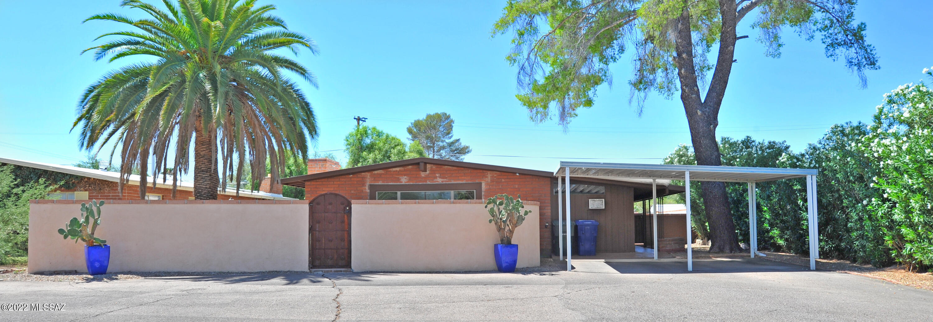 This solid red brick 4 bedroom home features a beautiful front courtyard and large rear yard with sparkling pool and easy care landscape!  Spacious open kitchen to the living room with fireplace.  Kitchen features granite counters, beautiful tile backsplash, built in appliances plus lots of cabinets and counter space.  Low energy windows, concrete floors, carpet in 2 bedrooms only, no popcorn ceilings, A/C, walk-in closets, ceiling fans, skylights in kitchen and hall bath, and laundry room with washer/dryer.  Lots of privacy and space.  Pool area is enclosed with a child safety fence.  1 yr minimum lease.  Non-smoking home.  $45 app fee per adult.  Renters insurance required.  Please do not disturb the tenants.  Home will be ready for occupancy July 1.