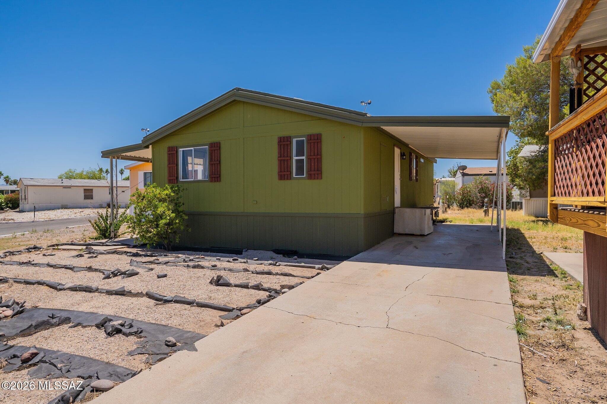 Beautifully renovated home complete with new floors, new cabinets, new counter tops, new exterior and interior paint job, remodeled bathrooms and new water heater & ac unit. Located right next to playground and dog park. House is located in mobile home park. Not in an HOA but does have a land lease. $600/month. Home can be relocated.