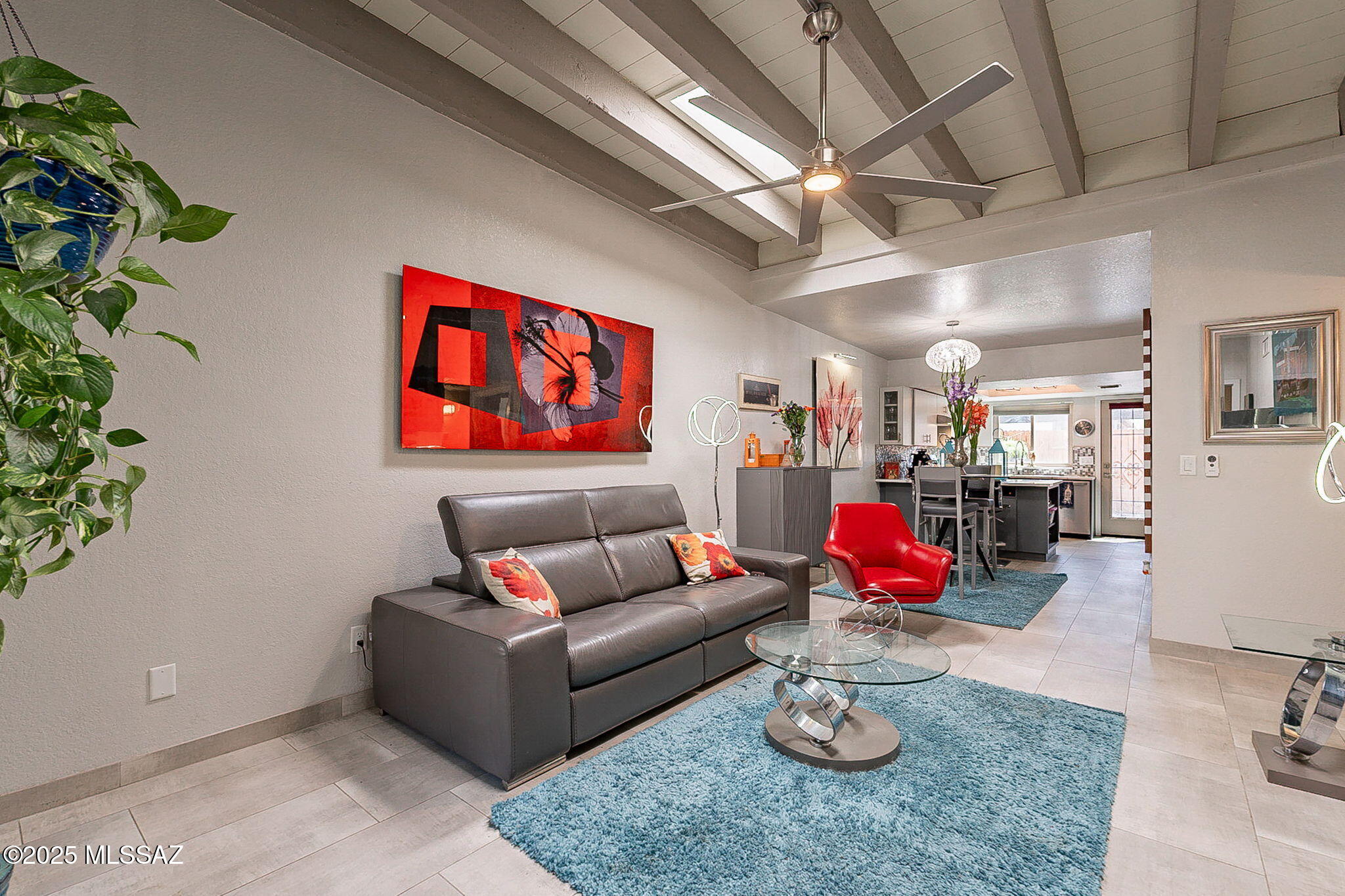 Seller will consider offers in range $285k-$300k. 3BR 2 Bath  located near Univ of Az, TMC, and Downtown. Open concept with high beamed ceiling in great room flows into dining/kitchen area. Everything is new over last 4 years with quality and style. 15x30 porcelain tile throughout, New paint,  elect outlets, switches, fixtures and fans. Kitchen features new custom cabinets, Stunning Quartz counters, Frigidaire Gallery stainless steel appl with Gas Range. Both bathrooms Fully Remodeled with glass tile & custom surrounds, new cabinets with vessel sinks,  new toilets. Trane HVAC 2023, New Milgard windows, New skylights, Hot water heater, elec insert Fireplace.  Patio has fencing,  storage shed, pavers and mulch.   Complete  upgrade list in documents. Nothing compares in this price range!!