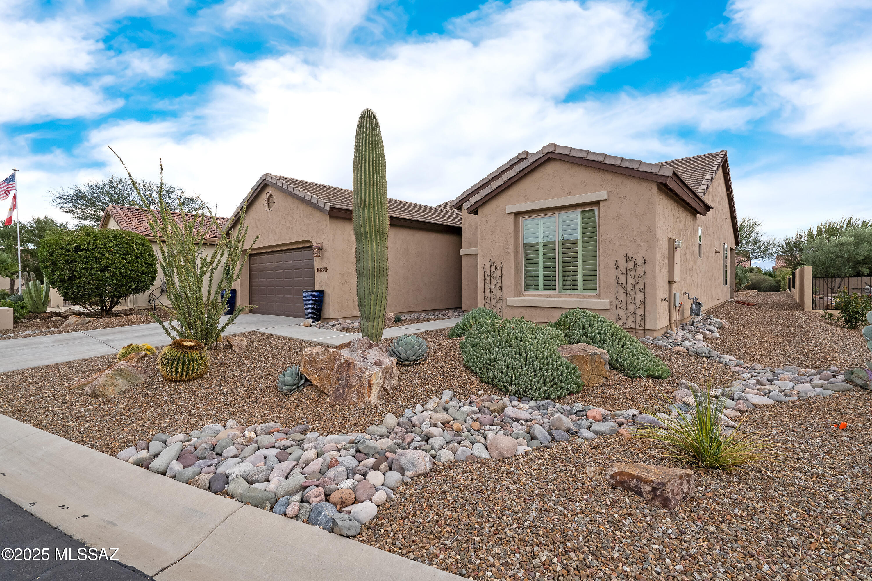 Beautiful move-in ready Dolce model just waiting for a new Buyer.  This popular floorplan features 2 bedroom/2.5 bath with den. Kitchen with island features dark wood cabinets, granite counters and sit up bar open to the great room and dining area making it the perfect plan for entertaining. Split bedrooms with guest bedroom that has private en-suite. Primary features dual vanities, step in shower, and good sized walk in closet.  Den is perfect for an office or can easily be converted to third bedroom if desired.  Home boasts surround sound, plantation shutters throughout and tile in all main areas. Enclosed screened in patio provides extra privacy to enjoy year round. Features large mature easy care backyard.  This is the perfect low maintenance home for snowbirds or year round living. Saddlebrooke Ranch is one of Robson's premier Active Adult communities that is gated and features high end amenities including indoor/outdoor pools, fitness, tennis, 24 pickle ball courts, Tech & Activity center, multiple restaurants including a brewery, 18 hole golf course, and tons of additional activities, clubs, and classes.  Start enjoying retirement today in this vibrant community.