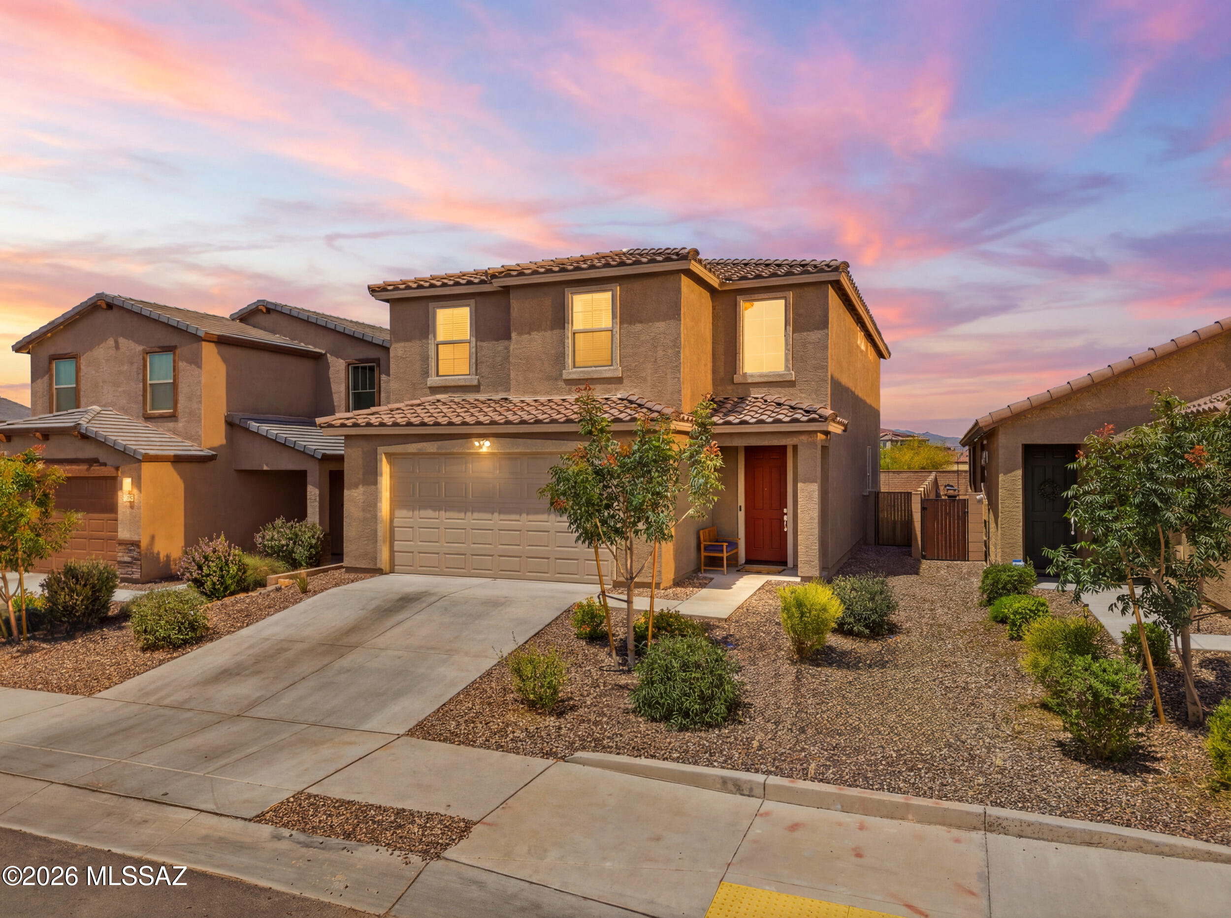 Owner/Agent. Rare opportunity to own a like-new Lennar home built in 2024 with an expansive 85-foot deep backyard that's already landscaped and ready to enjoy. Featuring 30' x 40' turf, pavers, and decorative rock, this oversized outdoor space offers endless possibilities to create your dream Arizona backyard with room for a pool, outdoor kitchen, fire pit, or entertaining area.

Situated on a premium elevated lot with no rear neighbors, the north-facing backyard captures Catalina and Rincon Mountain views while providing exceptional privacy. Just a short distance from the community pool and pickleball courts, you'll enjoy resort-style amenities and a lifestyle that feels like vacation year-round. The Abbott floor plan by Lennar features one of the largest kitchens in the community, complete with a spacious island that seats up to five, abundant cabinetry, granite countertops, and an open-concept design that seamlessly connects the kitchen, dining area, and great room. High ceilings throughout the main floor enhance the home's bright, open, and airy feel. 

Upstairs, the primary suite offers mountain and backyard views, a walk-in closet, and an ensuite bath. Three additional bedrooms, with walk-in closets, are thoughtfully separated by a versatile loft, providing flexibility for a second living space.

Energy-efficient features include a Rinnai tankless water heater, smart thermostats, built-in TAEXX pest control system, post-tension foundation, and an EV charging port in the two-car garage.

Located in desirable La Estancia, a master-planned community within the Vail School District, residents enjoy access to parks, playgrounds, two community pools, a splash pad, The Loop, and convenient access to some of Tucson's top employers.