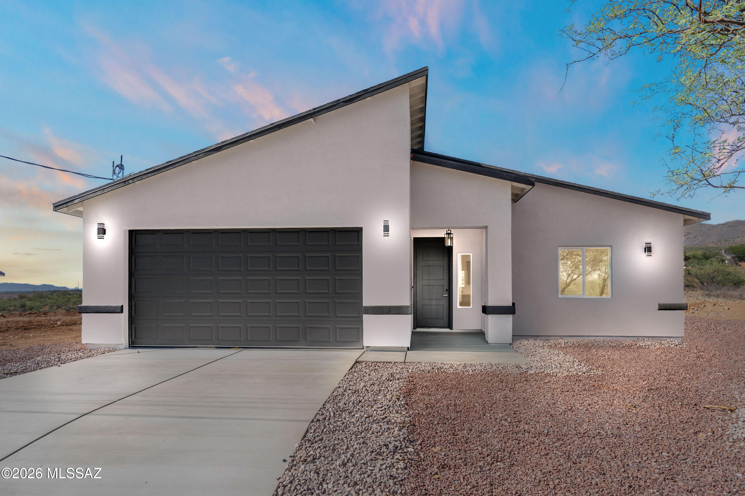 Perched on a scenic hillside, this 4-bedroom, 2-bathroom home offers 1,732 sq ft of modern living with breathtaking mountain and city views. The elevated lot provides privacy while showcasing sweeping vistas from multiple areas of the home. Inside, clean lines and contemporary finishes define the space, including quartz countertops and large-format 24x48 ceramic tile flooring for a sleek, low-maintenance feel. The open layout seamlessly connects the kitchen and living areas, ideal for everyday living and entertaining. Striking modern pitched rooflines with varied angles give the home a unique, elevated curb appeal. With its blend of style, function, and unbeatable views, this hillside property offers a rare opportunity for refined living.

OWNER/AGENT