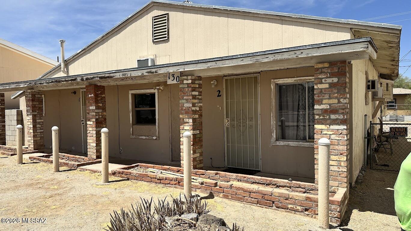 Fixer Duplex in Historic Ajo -  Investor Special! Historic district duplex located in the heart of downtown Ajo, just steps from the municipal center and main corridor. This property offers a strong value-add opportunity for investors seeking a project with long-term upside. One unit partially accessible with flexible layout; second unit condition unknown. Property is being sold as-is and will require improvements, including systems and finishes. Prime location with walkability to downtown amenities and community events. Ideal for renovation, rental income potential, or redevelopment within Ajo's historic district. Buyer to verify all facts, utilities, and measurements. Property sold as-is; seller will make no repairs. Appliances and certain fixtures may not convey.