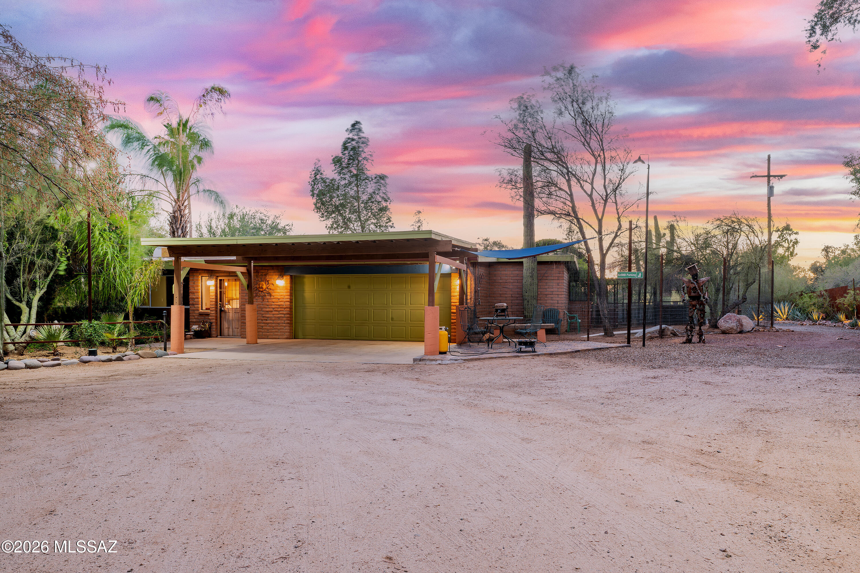 Unlike anything else in Tucson! This 3.6 acre property on shared well water, has been thoughtfully developed by the award winning designer/owner for over two decades, creating this truly unique private desert oasis. There are professionally designed gardens, pathways, outdoor living spaces, and tranquil water features covering almost an entire acre. The 3-bedroom 2-bath 2641 Sq ft main house is full of character, with spacious living areas, abundant natural light and classic Southwestern architectural appeal. The separate 810 SQFT guest house adds exceptional flexibility with 1 bedroom, 1 bathroom, a dedicated office, full kitchen, and private living space; ideal for guests, multigenerational living, home business, or rental(over $2,000 month). Offered at $55,000 less than appraised value!
