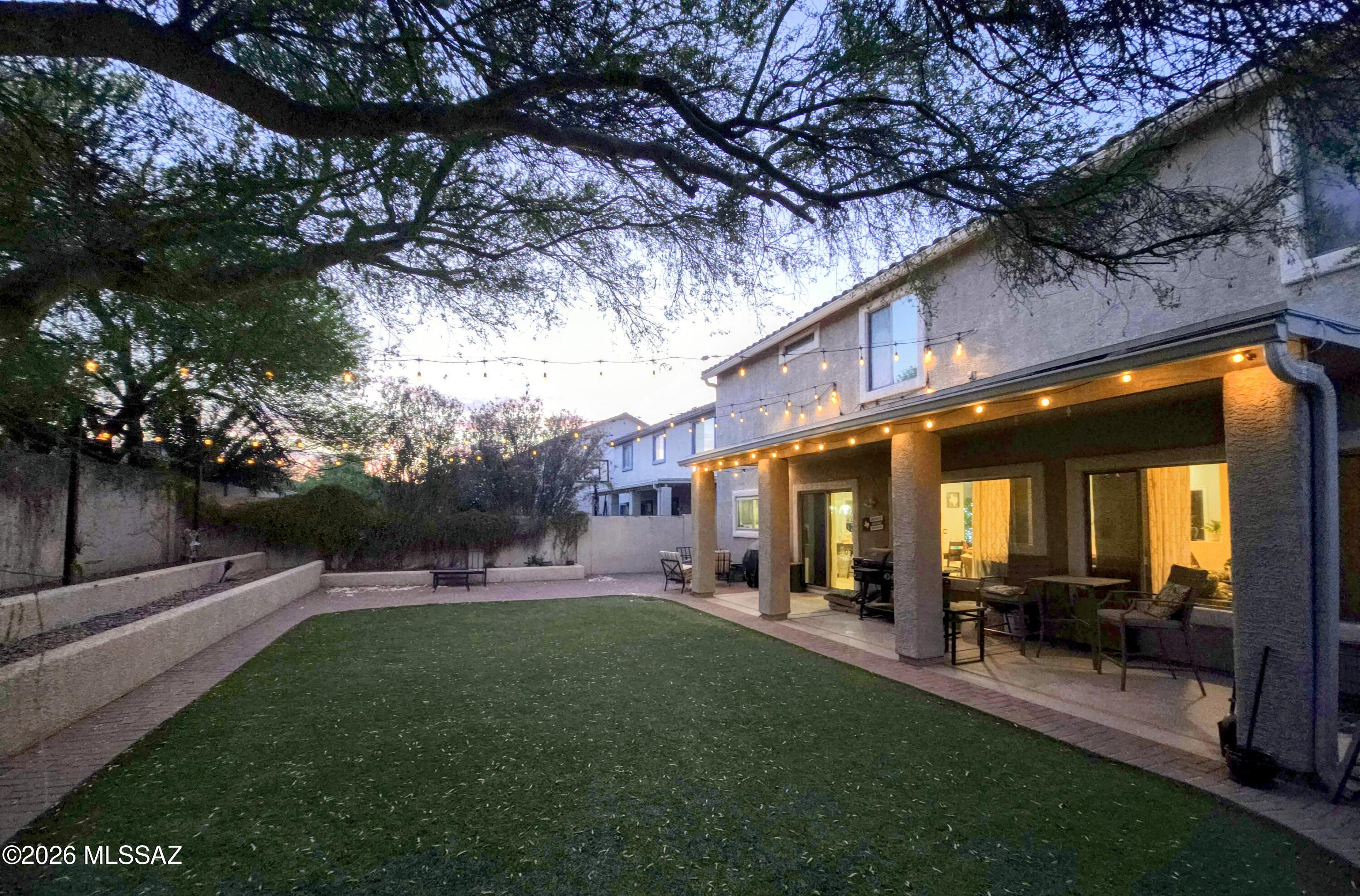 Get ready to fall in love! Located in the award-winning Rancho Sahuarita community, this stunning home features one of the largest floor plans available with 6 spacious bedrooms and room for everyone. Enjoy a bright living and dining area that flows into a great room and light-filled kitchen with granite counters, custom cabinetry, stainless steel appliances, gas range, and double oven. New beautiful durable flooring throughout the main floor and staircases. A main-floor bedroom and full bath offer flexibility for guests or office space. Upstairs boasts a luxurious primary suite, loft, and additional bedrooms including a Jack-and-Jill layout. Step outside to a large private backyard with artificial grass, raised beds, covered patio, and a storage shed. Convenient interstate access.