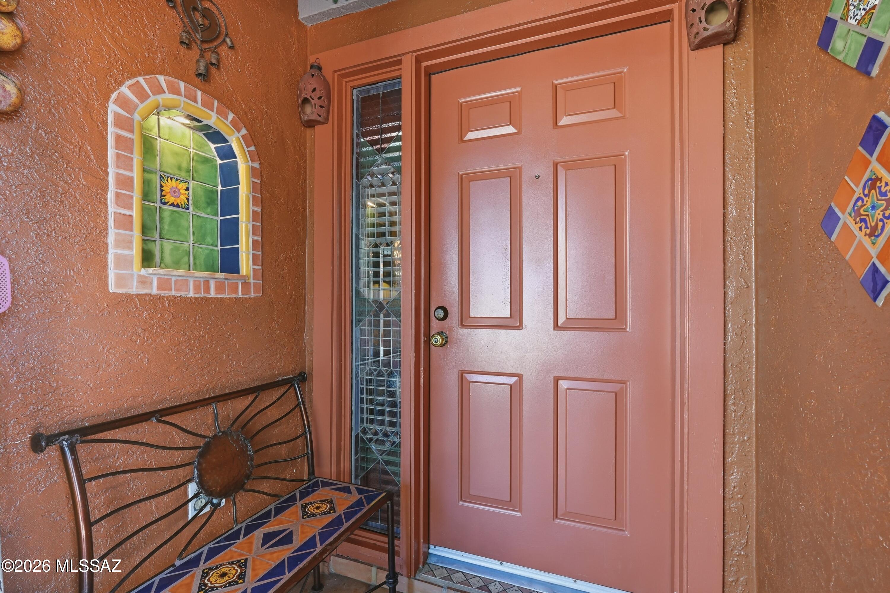 Bursting with authentic SW charm, this delightful casita is a true desert jewel! Rich with Talavera accents throughout, from colorful sinks and handcrafted light switch covers to rustic handles, pottery, alcoves, and vibrant tile work. Every detail celebrates the beauty and artistry of the SW. Warm natural tones, authentic rustic furnishings, and unique saguaro rib accents create a cozy yet unforgettable atmosphere full of character and charm.
This inviting 1 BR retreat is tucked within a charming courtyard community of just 8 units, where the sparkling pool, relaxing hot tub, and community room are only steps from your front door. Ideally located near GVR West Center, shopping, and restaurants. This special property offers the perfect blend of convenience, communityand easy desert living. Whether you're seeking a seasonal escape or your very own "Home Sweet Desert Home," this casita captures the spirit of Southern Arizona living at its best.