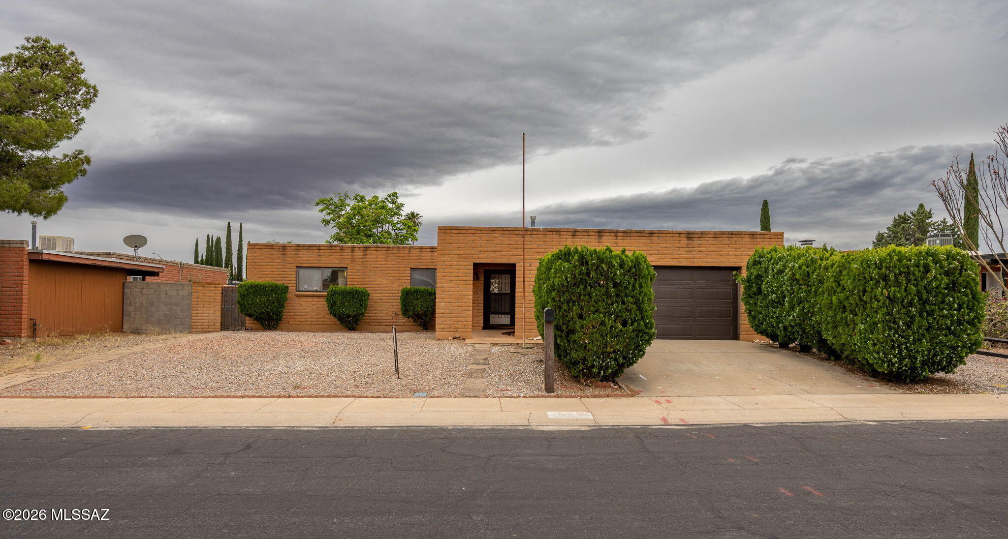 Welcome to 5154 Calle Virada, this home has been lovingly maintained over the years with all the right updates. Home features central AC, storm doors and windows, newer tiled shower, tile floors in common areas, a huge laundry room. There's new carpet in the large bedrooms, and the walls of the home have been freshly painted. Enjoy quite nights by your lovely fireplace in the family room. Step out back onto your screened in Arizona room and take in the large landscaped backyard. Front yard features mature hedges and a gravel landscape. Keep your cars out of the sun and rain in your large two car garage. Owner agent.
