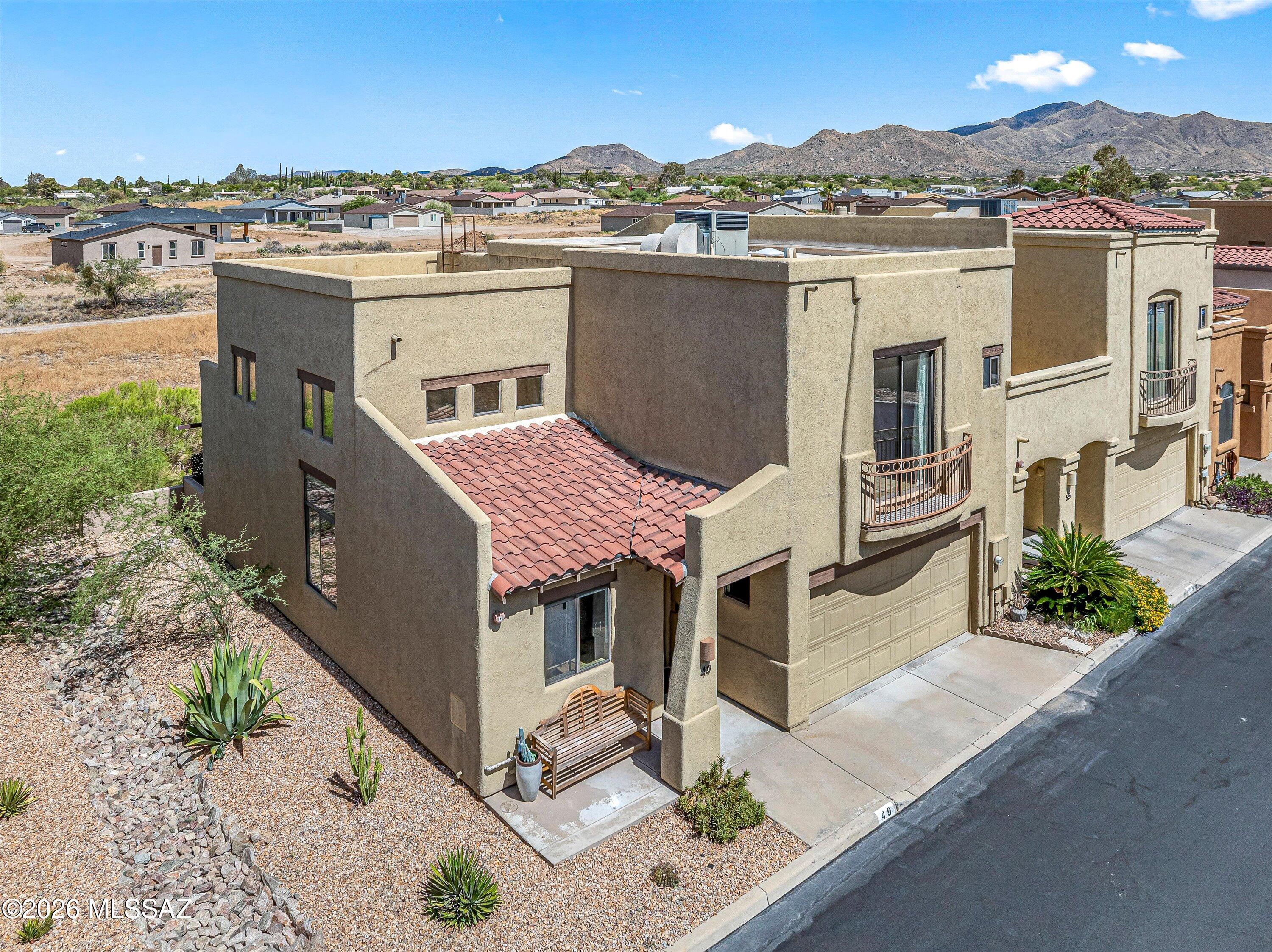 Enjoy the perfect blend of comfort, convenience, and low-maintenance living in this spacious end-unit townhome nestled in the heart of Corona de Tucson! With no direct rear neighbors, beautiful mountain views, and guest parking just steps from the front door, this 3-bedroom, 3-bathroom home combines thoughtful design and everyday convenience. Inside, you'll find an open, light-filled floor plan with soaring vaulted ceilings, expansive windows, and generous living space. The desirable downstairs primary suite provides added privacy, while two additional bedrooms and a 'jack and jill' bathroom upstairs offer flexibility for family, guests, or a home office - with one bedroom featuring a charming Juliet balcony. Thoughtfully updated throughout, this home offers peace of mind with a new HVAC system (2024), recent epoxy cork roof coating (2024), and new water heater (2022). The kitchen has been beautifully refreshed with a Samsung Wi-Fi/Air Fry range (2022), Samsung dishwasher (2025), microwave (2022), and an upgraded sink, faucet, and garbage disposal (2025). Additional updates include new window blinds (2022) and an LG washer and dryer (2025), making this home truly move-in ready. The covered patio is the perfect spot to relax and take in the mountain views, while the small backyard offers easy upkeep so you can spend more time enjoying life and less time maintaining it. Complete with a two-car garage, this home is ideal for those seeking spacious living without the maintenance of a larger property--all just a short drive south of Tucson! Price Range Listing - Seller will accept or counter offers between $295,000 - $305,000.