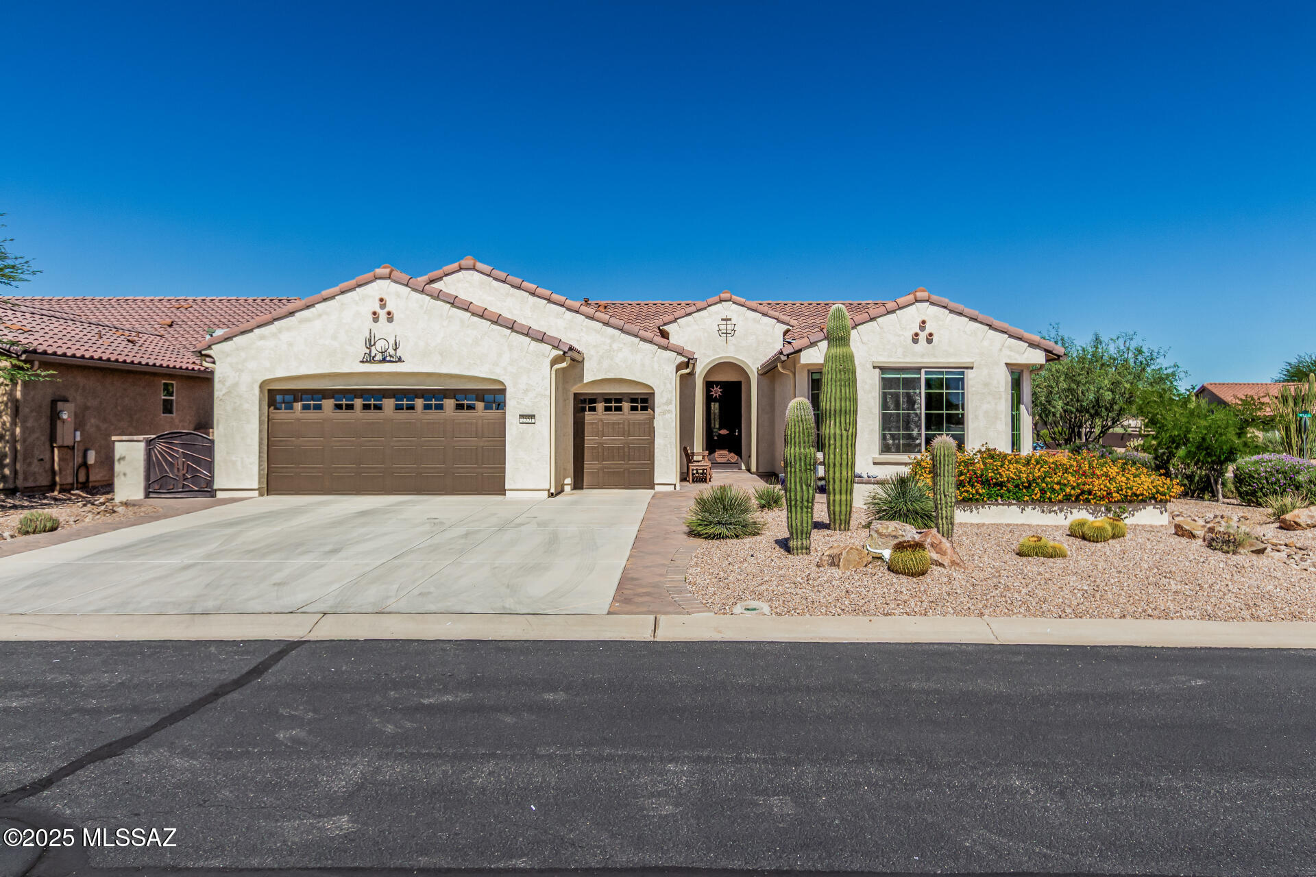 Step into the easy pace of Quail Creek living in this inviting Cortez model. Natural light fills the home, highlighting comfortable spaces and an easy flow with open views of the private arroyo. The living area is perfect for casual get-togethers, while the covered patio is ideal for enjoying beautiful evenings. At the heart of the home, the kitchen with its large island is perfect for hosting friends or savoring a quiet cup of coffee. The primary suite offers a peaceful retreat at day's end, and the easy-care yard gives you more time for the things you love. Guests will feel right at home with a private en suite bedroom, while the den with twin Murphy beds adds extra flexibility. Wait until you see the garage space with extra room inside, including golf cart garage.