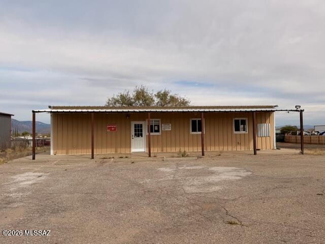 Prime Commercial Opportunity with I-10 Exposure!   Conveniently located just off I-10 at the J-6/Mescal exit, this property offers outstanding visibility and easy access via a paved frontage road (Meadowlark). The 1,482 sq. ft. metal building sits on 0.80 acres and is fenced with chain-link and razor wire for added security in the front.  Wood fence on east and north sides. The site features paved parking and General Business zoning in rural Cochise County, making it ideal for a wide range of uses. High-traffic I-10 frontage in the J-6 Mescal area provides excellent exposure—perfect for a feed store, small equipment repair shop, or other commercial ventures.  One of the owners is a licensed  real estate agent in AZ.