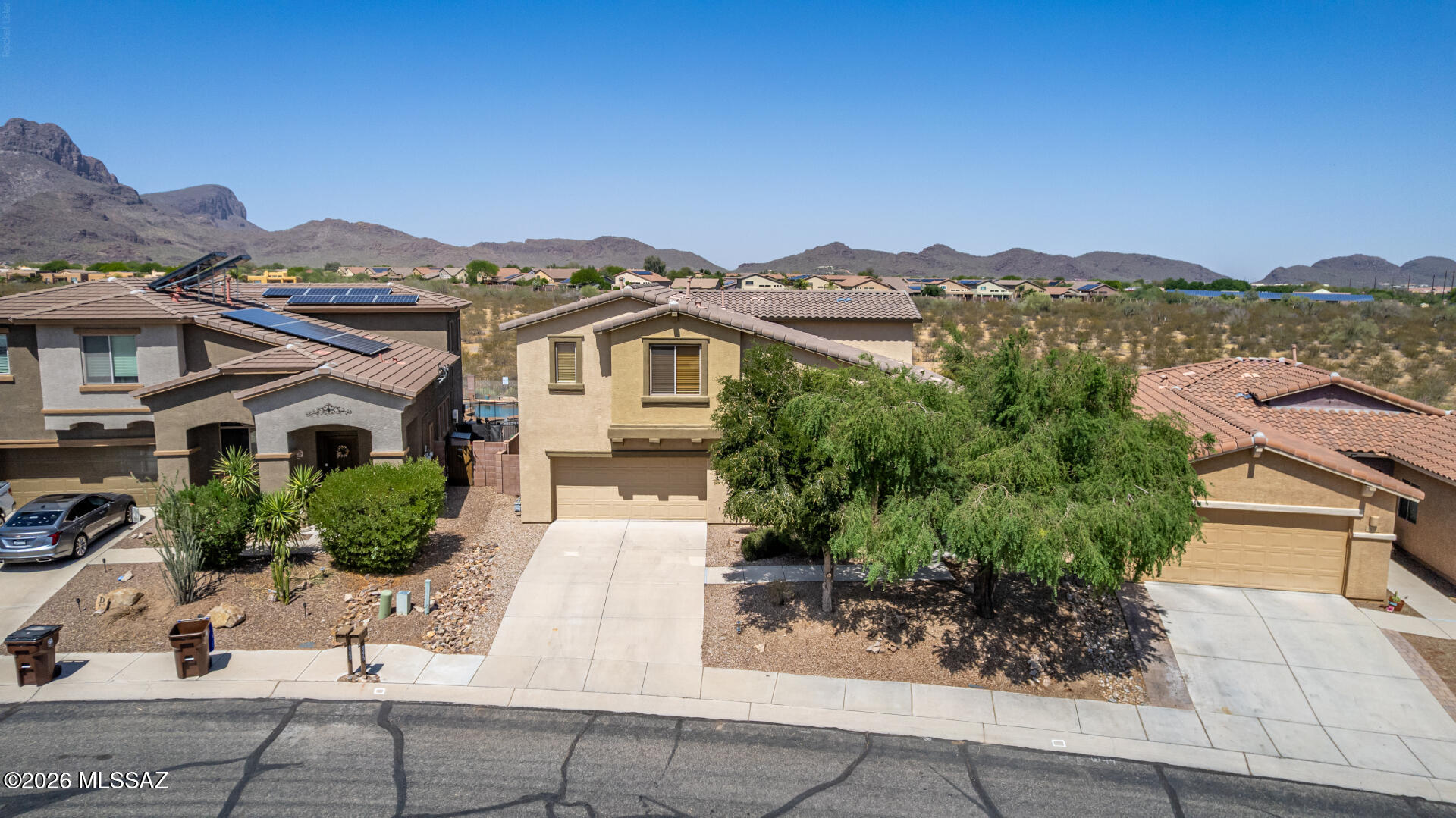 Range-Priced from $450k-$465k. PREMIUM VIEW LOT in UPGRADED CONDITION. 2-Story Home w/a 3-car Garage w/ NO REAR Neighbors & Stunning Views of Sombrero Peak & sunsets. The interior is sure to impress w/a Bright & Airy Living & Dining Room w/a dry bar ideal for welcoming guests, along w/the desirable great rm enhanced by a cozy fireplace, perfect spot for entertaining & relaxing evenings. High end kitchen w/ recessed/pendant lighting, tile backsplash, a walk-in pantry, newer SS appliances, abundant cabinetry, quartz counters,new sink & island w/a breakfast bar. 20'' tile floors in high traffic areas. Large main bedrm, & enjoy amazing mtn views from balcony access, an ensuite w/a makeup desk, & a walk-in closet. Outdoors the spacious backyd w/a covered patio ext. fireplace, & built-in barbecu