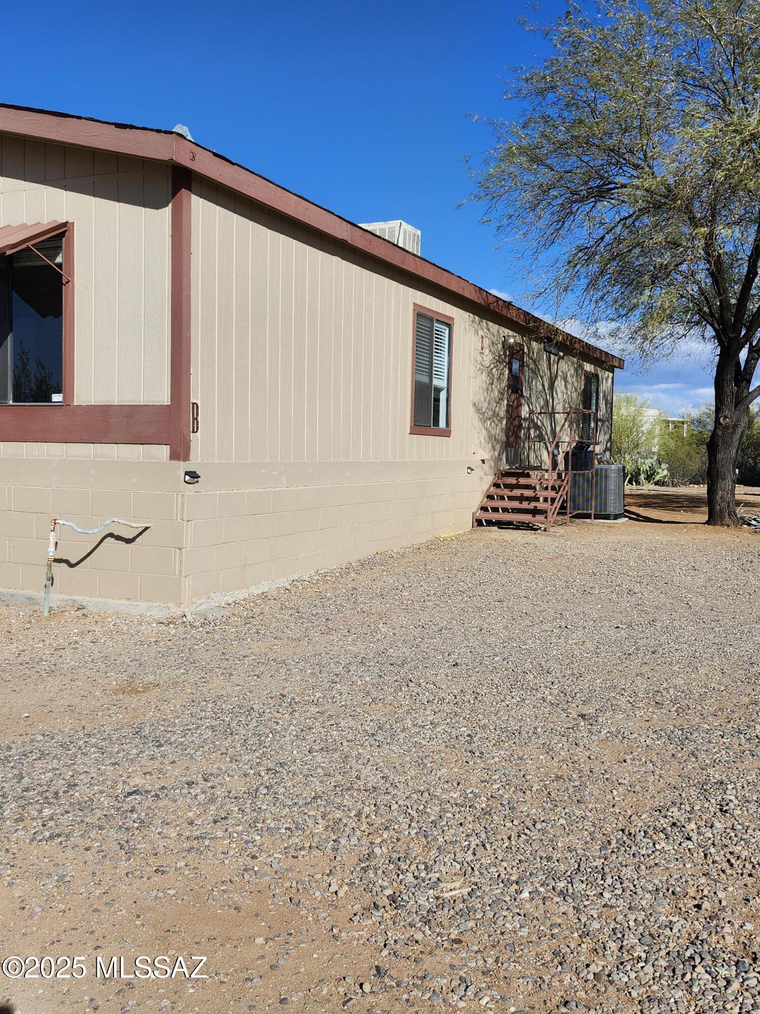 Nestled near the breathtaking Saguaro National Park, this charming 2-bedroom, 2-bathroom manufactured home offers a serene retreat with stunning mountain views. The property boasts spacious living areas, a well-equipped kitchen, and cozy bedrooms designed for comfort. Imagine waking up to the beauty of the Sonoran Desert and enjoying peaceful evenings on the patio, surrounded by nature's splendor. Perfect for those seeking tranquility and proximity to outdoor adventures, this home is a true gem.