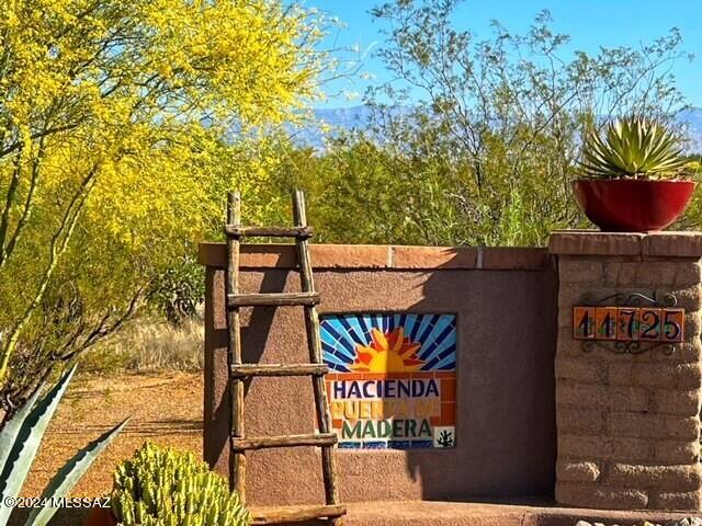 Welcome to Hacienda Puerta de Madera, a sprawling single story mud adobe Hacienda. This one-of-a-kind home is constructed from traditional sun-dried mud adobe bricks which not only is charming but provides thermal insulation. Sitting high on 3.31 acres with 5 bedrooms, 4 full baths, and 2 half baths, including a versatile gym room and a storage room converted into an office/craft space. One bedroom and bath is a separate guest suite with its own entrance. High ceilings, large windows and natural light highlight the unique adobe bricks. The gorgeous kitchen is the interior main attraction while outdoor living awaits with fully equipped BBQ area, pool, spa and outdoor dining. 4.5 car garage, fully owned solar, RV hook-up, roof top deck are just a few of the incredible features of this home.