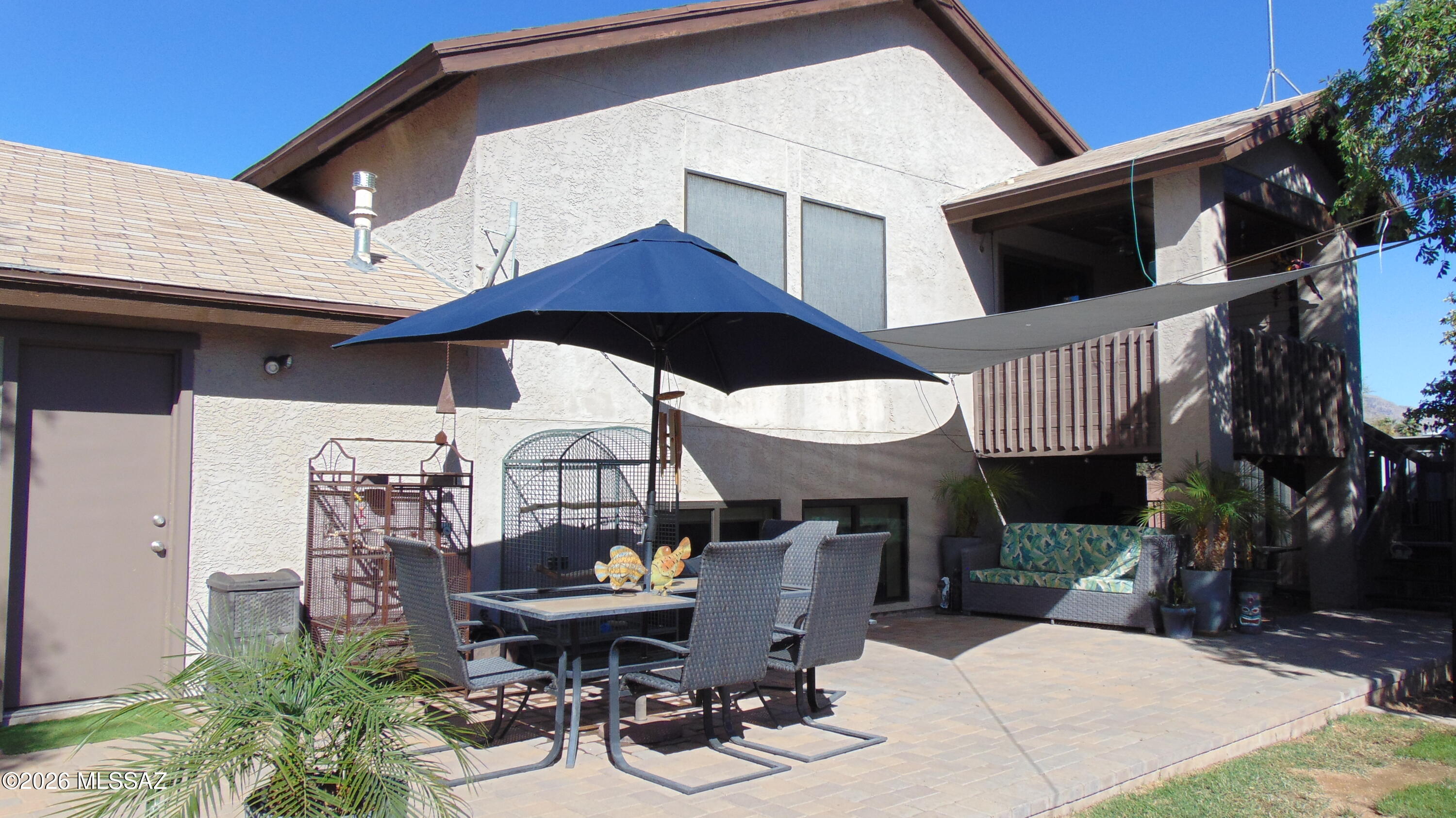 Rare opportunity in the Northwest! This spacious, well-built home sits on a massive 1/3+ acre cul-de-sac lot, perfect for a growing family. The upper level features a bright kitchen, living room, and three bedrooms, including the primary suite. The lower level offers incredible flexibility with two additional bedrooms, a large family/entertainment room, a laundry room with a sink, and a bonus kitchenette. Enjoy outdoor living with a large balcony, mature trees, a sprawling paver patio, a dog run, and plenty of room for RV parking. Great home for multi-gen. Price reduced, motivated seller.