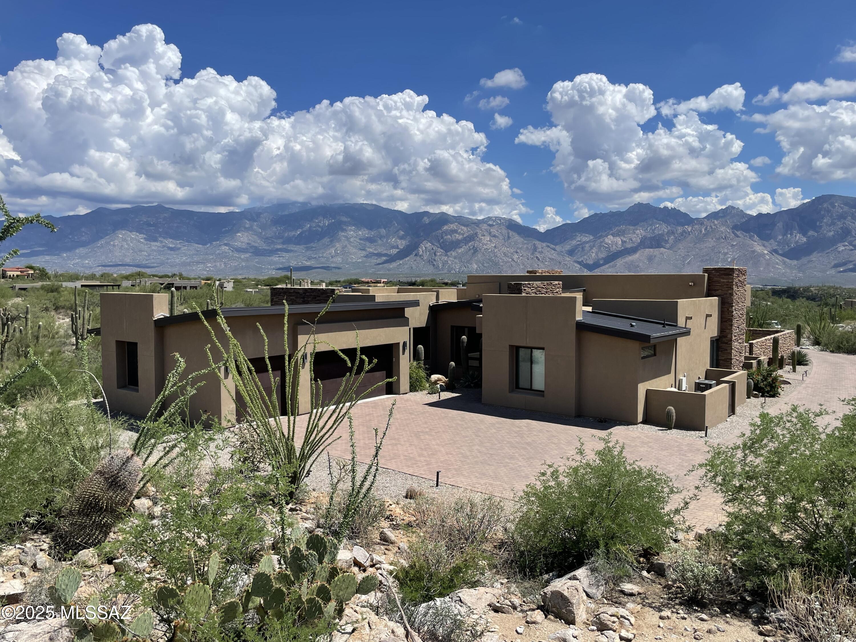 An exceptional Jon Anderson designed residence in Tucson's Stone Canyon Club, the premier, private, guard-gated golf community in So. Arizona. Situated on a private, elevated, 1.75 ac. lot, featuring some of the best unobstructed views of the Catalina mountains in all of Stone Canyon. 3,142 sq ft interior living space finished with the finest choices. High ceilings, open floor plan, beautiful porcelain flooring along with lush carpet in the bedrooms, beautiful granite selections and high-end cabinetry. Amazing mountain views! Pool/spa, linear firepit, and built-in BBQ. This home was built in 2019 and is in immaculate like-new condition. 3 bedrooms, den, 4 baths, 3 car garage. See the attached Features & Description PDF for the extensive list of amenities. Contact agent for more info.