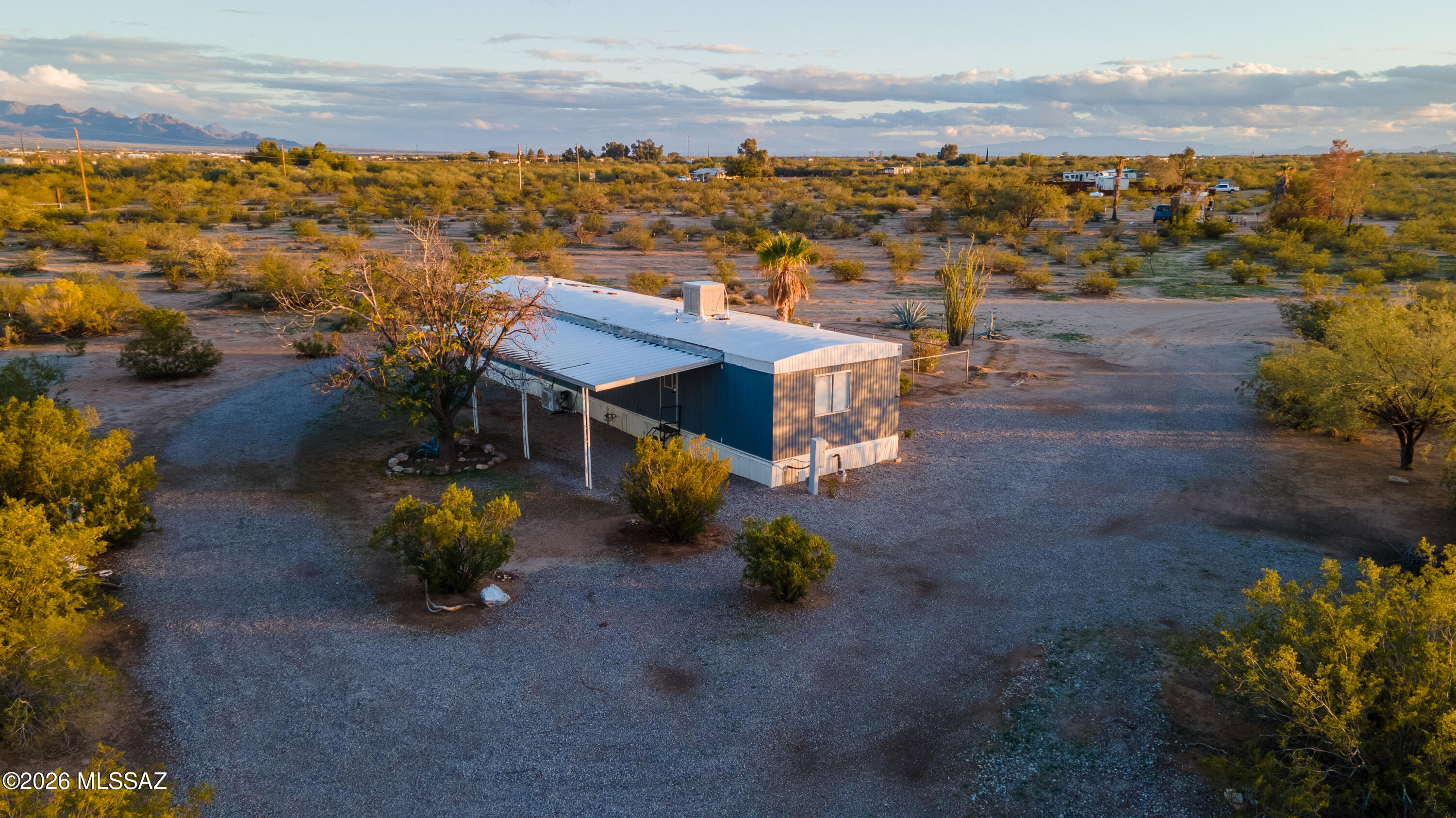 OWNER/AGENT - Excellent opportunity to live in one property, and derive income from the other.  This 10 Acre Property has a singlewide mobile that has been recently renovated and is move-in ready.  It also has a second RV site with it's own septic, water, and electricity that has been rented on short term rentals with 4 years of rental history.  Possible option to build a home at the RV spot and rent out the single wide.  Beautiful sunrise and sunset views, lots of privacy.  Enjoy morning coffee on the beautiful deck with fenced yard.  Adjacent 20 acre parcel with 2 homes and 1 RV site also available as a separate sale.  OWNER/AGENT