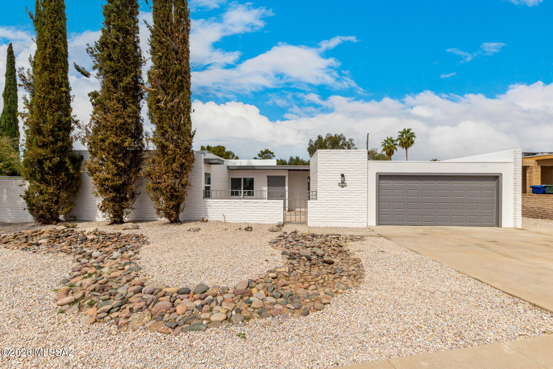 Tucked away on a quiet cul-de-sac, this inviting home offers comfortable indoor and outdoor living with great upgrades throughout. Enjoy a charming courtyard entry, low-care front yard, bright floor plan, neutral paint, tile flooring in key areas, ceiling fans, and multiple living spaces ideal for everyday living or entertaining. The kitchen features white cabinetry, stainless steel appliances, quartz countertops, and a functional U-shaped layout with plenty of storage. The primary bedroom includes a mirrored closet and private bathroom. The easy-care backyard offers a covered patio and refreshing pool, perfect for relaxing or entertaining. Additional highlights include a 2-car garage with epoxy flooring. Owner/Agent.
