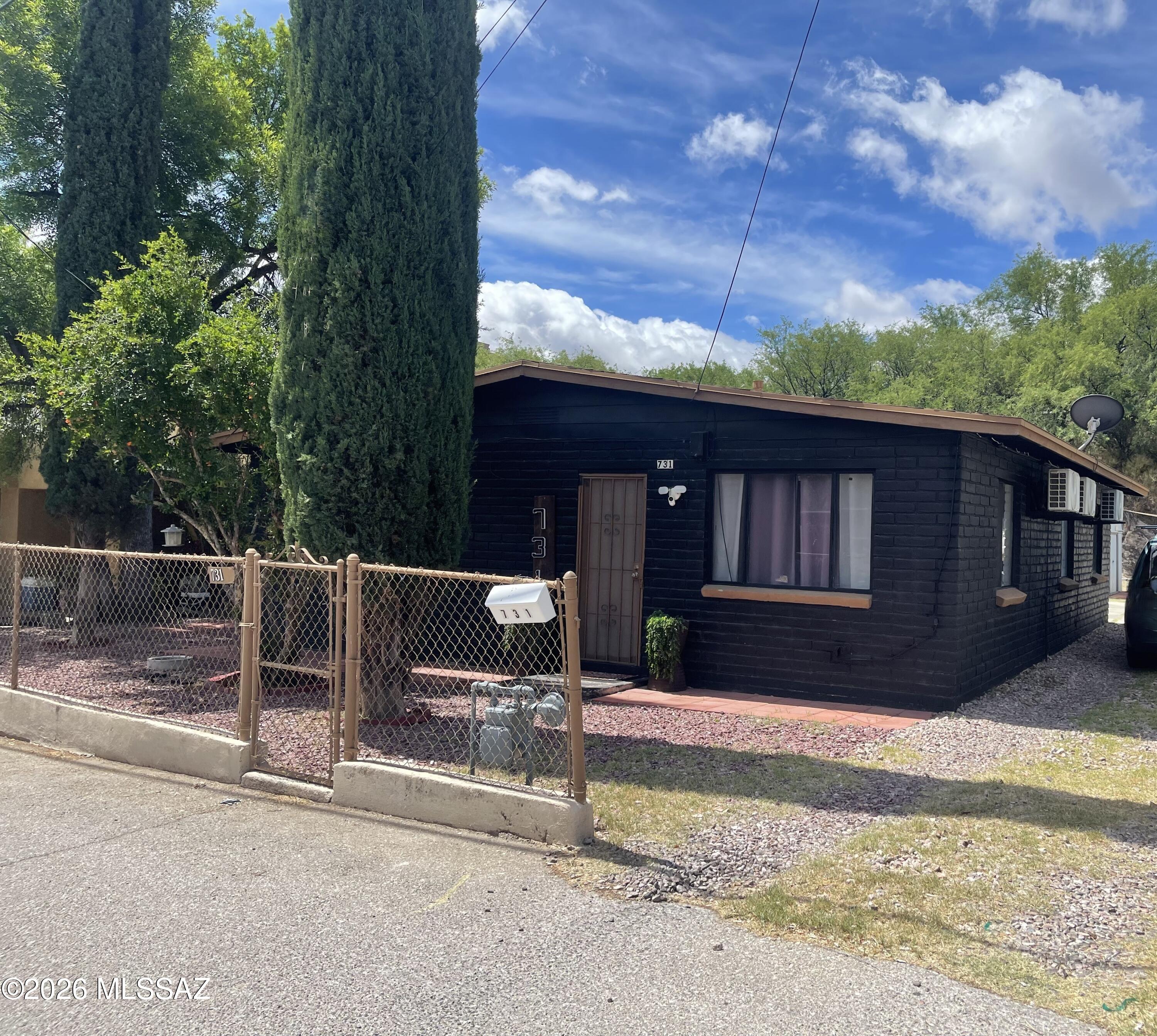 Centrally located home in Nogales.   This move-in ready property has been recently remodeled with laminate floors, interior paint, new kitchen cabinets and granite countertops, ceiling fans, upgraded led light and plumbing fixtures.   It offers a spacious rear yard with two storage sheds.   Conveniently located near schools, shopping, and downtown restaurants.