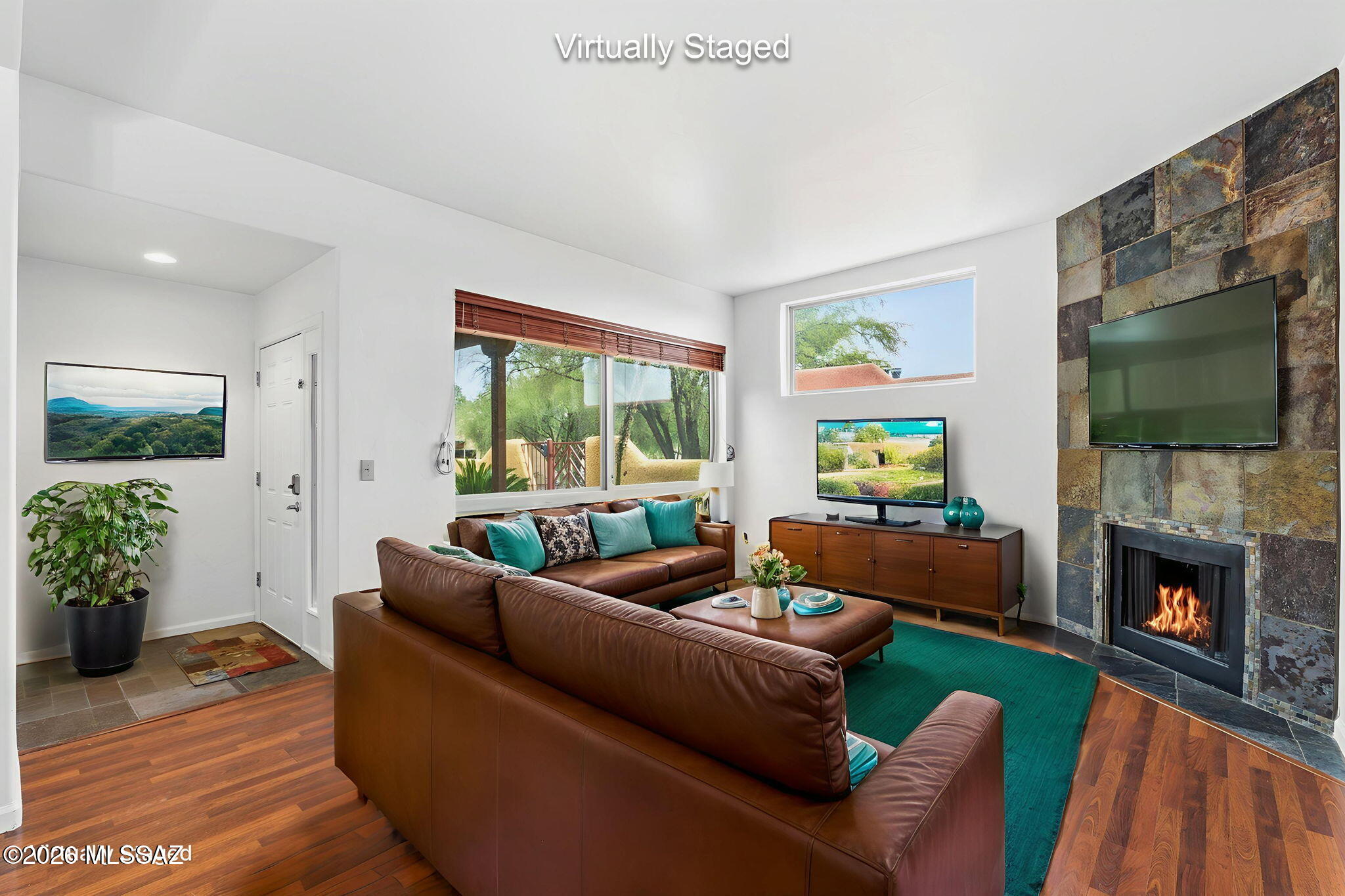 Range Priced: $300,000 - $315,000.  Incredible Location. Welcome to this tastefully updated 2-bedroom, 2-bathroom condo in the highly sought-after Reflections in the Catalinas community. Nestled on the ground floor, this spacious 1,258 sq ft single-level unit offers an open-concept great room anchored by a cozy wood-burning fireplace, soaring ceilings, and a private front courtyard -- your own peaceful retreat.
The modern kitchen is beautifully appointed with granite countertops, stainless steel appliances, and a convenient built-in desk or work area. Both bathrooms have been tastefully refreshed with updated tile countertops and fixtures. Additional highlights include dual-pane windows, walk-in closets in both bedrooms, and a dedicated laundry room. More-->