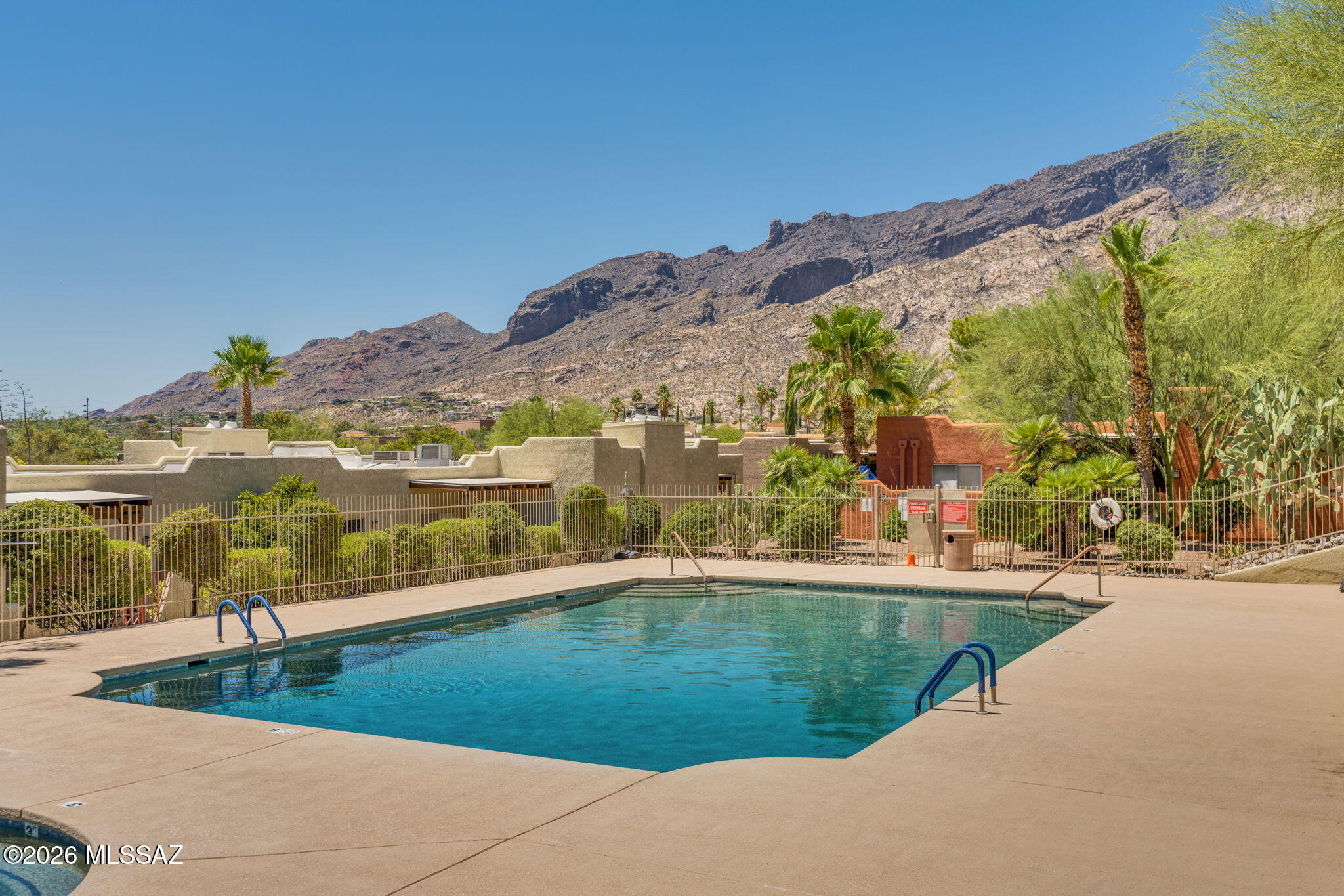 Range Priced: $300,000 - $315,000 and FHA approved.  Incredible Location. Welcome to this tastefully updated 2-bedroom, 2-bathroom condo in the highly sought-after Reflections in the Catalinas community. Nestled on the ground floor, this spacious 1,258 sq ft single-level unit offers an open-concept great room anchored by a cozy wood-burning fireplace, soaring ceilings, and a private front courtyard -- your own peaceful retreat.
The modern kitchen is beautifully appointed with granite countertops, stainless steel appliances, and a convenient built-in desk or work area. Both bathrooms have been tastefully refreshed with updated tile countertops and fixtures. Additional highlights include dual-pane windows, walk-in closets in both bedrooms, and a dedicated laundry room. Make it yours now.