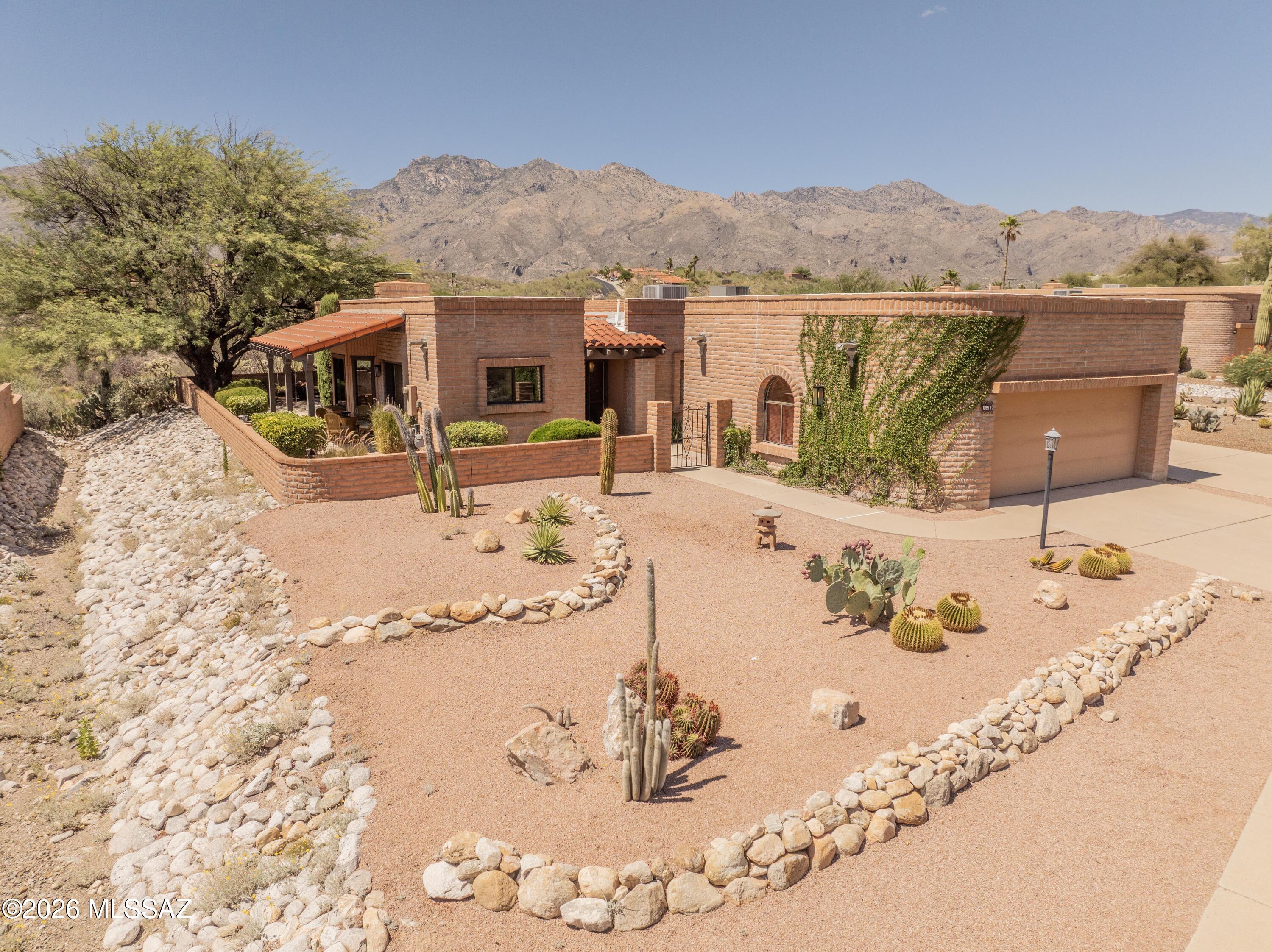 Looking for serenity in a meticulously maintained home in Fairfield in the Foothills? Catalina Mountain views from all main living areas. A townhome community with unexpected privacy includes desert and mountain views to the North and South. The updated finishes and the spacious open floor plan including 3 bedrooms, 2 baths, and a 2 car garage, should put this one at the top of your list. Beautifully appointed desert landscaping. The famous Sabino Canyon and Resort Style Golf Courses are within minutes. Walking distance to many hiking trails, popular dining options, a full service grocery store, and fitness facilities help you maintain an active lifestyle.  Last but not least, this home is steps to the Community Pool, Spa, and Tennis court with low HOA dues. Scenic living at its best!