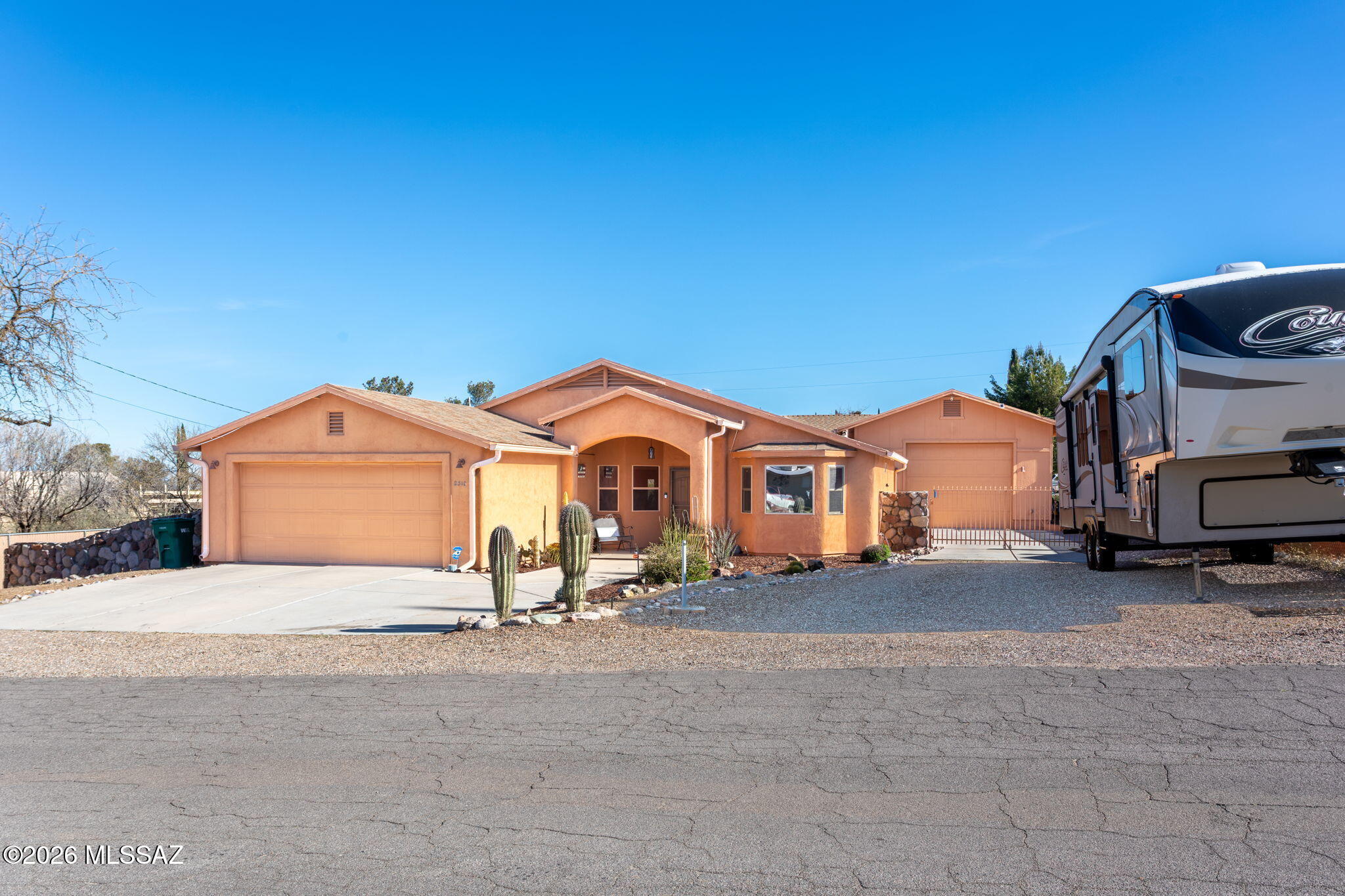 WHAT'S NOT TO LOVE??? CUSTOM HOME IN THE QUAINT HILLS OF COOLER ORACLE!! POSSIBLE NO DOWN PAYMENT W/USDA LOAN!! Come take a peek at this well-maintained home on a large lot with plenty of room for toys. Park your RV or boat in huge extra garage PLUS take advantage of the amazing workshop. When entering the home, you will enjoy the spacious, open floor plan with lots of light and high ceilings. The kitchen is the heart of the home and designed efficiently with newer appliances. The home features a split floor plan with large bedrooms. New flooring installed 2022 (except baths). COME EXPLORE THE ENDLESS POSSIBILIES IN THE BEAUTIFUL TOWN OF ORACLE