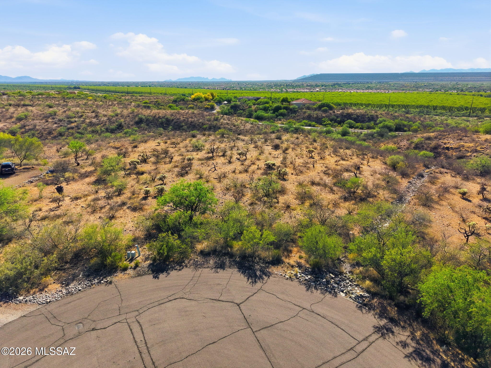 Tucked within the prestigious gated community of Madera Foothills Estates, Lot 11 offers a rare opportunity to build your dream home in one of Southern Arizona's most sought-after settings. Spanning over 2.07 acres, this premium homesite captures sweeping panoramic views, with the Santa Rita Mountains rising boldly in the distance--your daily backdrop for both sunrise and sunset. With ample space to design and orient your home just right, you have the freedom to maximize those breathtaking views while creating a private desert retreat that feels worlds away... yet remains close to everything. All utilities are already in place, including gas, electric, and water provided by Global Water Resources--no need for a well--making the building process that much more seamless. A septic system will need to be installed by the buyer. Optional GVR membership is also available, offering access to a wide range of recreational amenities.

This is more than just land--it's the foundation for your next chapter. Bring your vision, your plans, and your dreams... and make this exceptional homesite your own.
