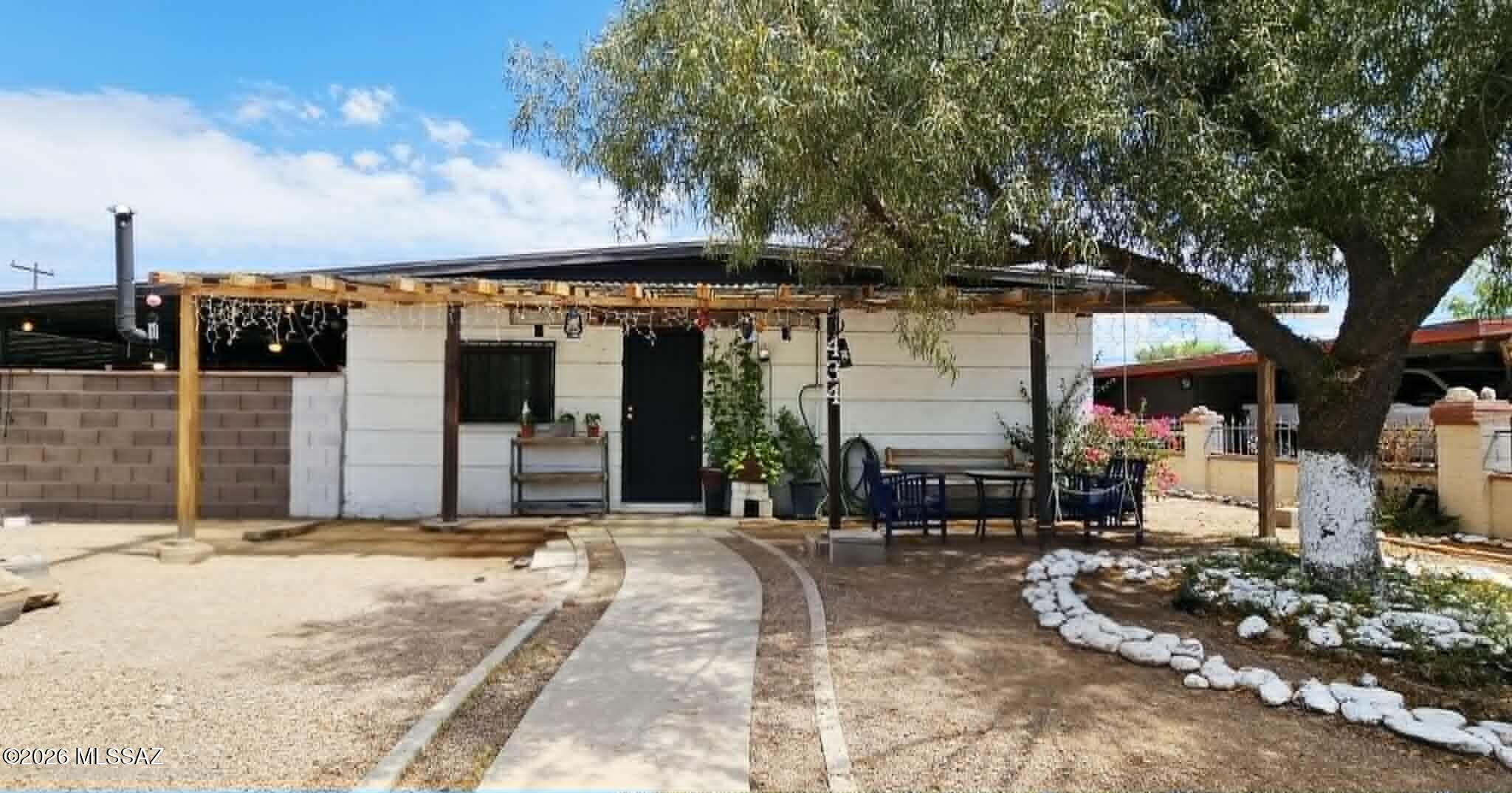 Great starter home at great price. 3 bedrooms 2 full bathrooms 2 carport 1 story with indoor laundry. Remodeled kitchen & bathrooms in 2019 with new tile flooring, interior plumbing re-piped to the street, upgraded electric to 200 AMP, newer lighting, newer water heater, newer AC, newer double-paned windows. Large fenced back yard with mature trees. Lovely landscaped front yard with fence and gate. 2 carport parking space with sliding metal gate. Large covered back patio and front porch. Multiple storages / sheds, lots of room to expand & store toys. Zoned AC system with individual mini splits in each room plus swamp cooler. Convenient location near I-19, parks, entertainments, shopping.