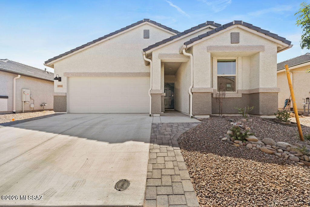 Welcome to this spacious and well-maintained home in the desirable Saguaro Bloom community. Featuring an open-concept floor plan, this home offers comfortable living with a bright great room that flows seamlessly into the kitchen and dining area. The kitchen includes ample cabinet space, modern appliances, and a large island perfect for meal prep or gathering with family and friends. The split-bedroom layout provides added privacy, while the primary suite features a walk-in closet and en-suite bath. Enjoy a low-maintenance backyard and access to community parks, walking trails, a pool, and other amenities. Conveniently located near I-10, shopping, dining, and schools.