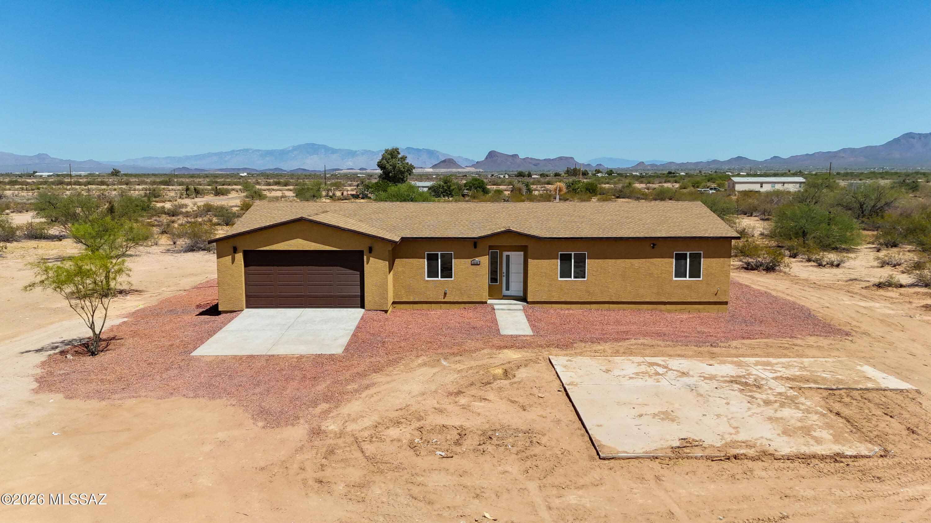 This stunning new build home offers 3 spacious bedrooms and 2 modern bathrooms, perfectly situated on 5 acres in the scenic Picture Rocks area. Enjoy breathtaking mountain views and the privacy of a long driveway that leads you to this beautifully designed property. Inside, the open floor plan creates a bright and inviting atmosphere, ideal for both everyday living and entertaining. The home features a beautiful kitchen equipped with brand new appliances, sleek finishes, and plenty of space for cooking and gathering. This property combines comfort, style, and peaceful desert living in one exceptional setting. Don't miss this unique opportunity to make it your own!