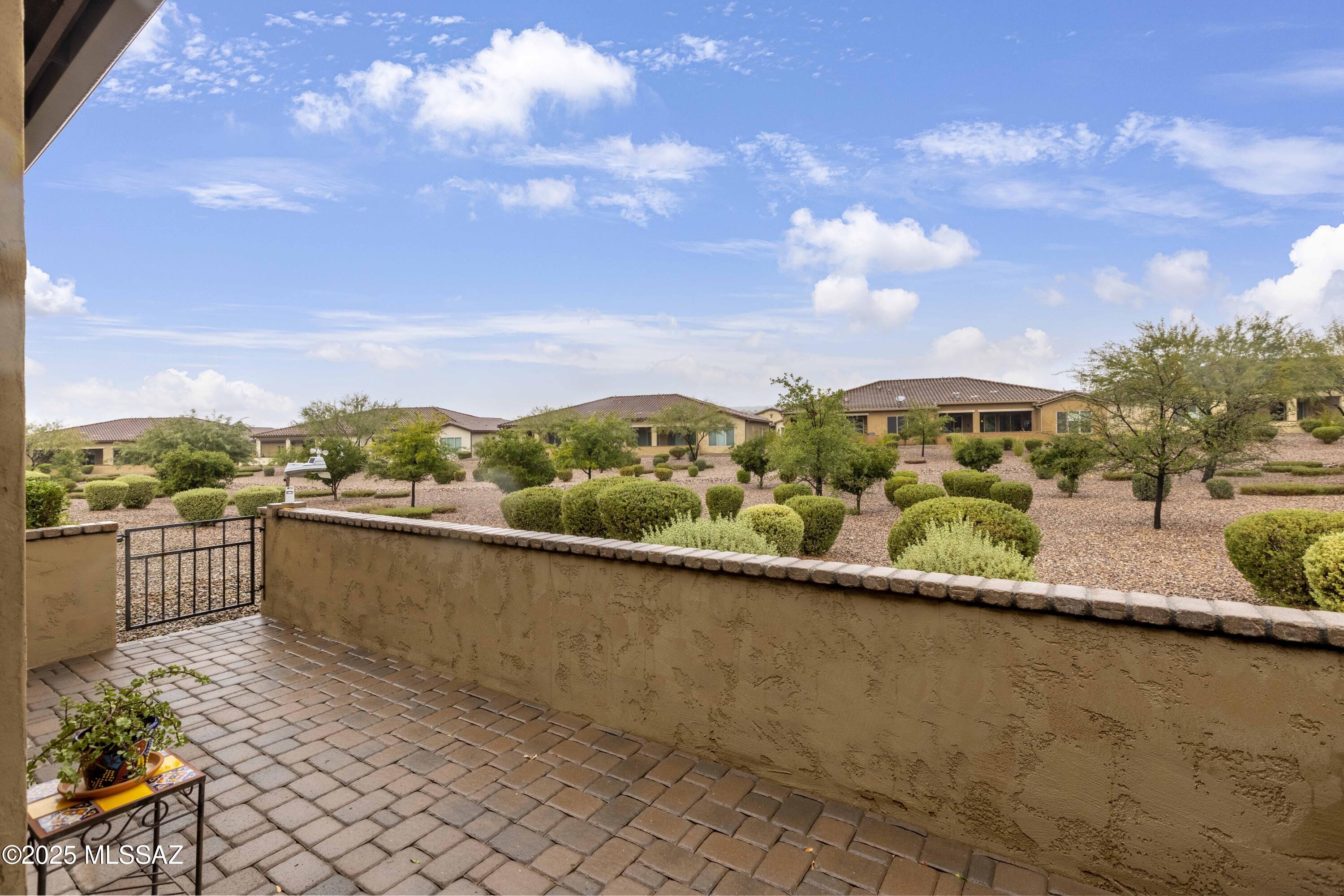 Exquisitely upgraded Lago Villa with over $65K in recent improvements & views of the Common Area.  Wood-look tile in principal areas, carpet in bedrooms. Great Room offers a custom entertainment center w/ 85'' TV included, remote window coverings, and dining area opening to a private paver patio. Den/office features glass French doors and custom built-ins. Kitchen features 42''h Alder cabinets w/slide outs, granite counters, new backsplash, pendant & under-cabinet lighting, large leather-finish island, 5-burner cooktop, and newer SS appliances. Primary suite has an upgraded walk-in shower and California Closets. Guest room offers plantation shutters & Bath a walk-in shower. Garage boasts  SS sink, cabinets, overhead storage, and Galaxy-finish flooring.Don't you deserve to Retire in Style!