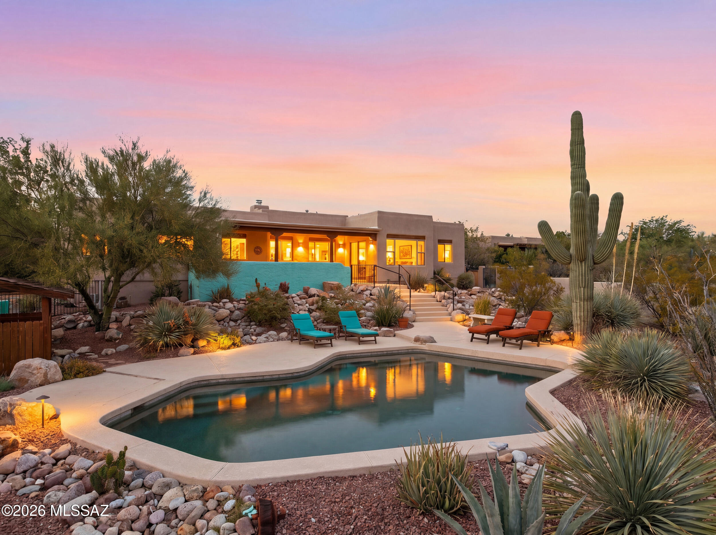 Experience true desert luxury in this exceptional home perched on an expansive lot with breathtaking panoramic mountain and sparkling city-light views. Designed to capture the beauty of Southern Arizona, this property offers a rare combination of privacy, outdoor living, and unforgettable scenery.

The backyard is an entertainer's dream, highlighted by a heated swimming pool that allows for year-round enjoyment while taking in the stunning sunsets and surrounding mountain vistas. Whether hosting guests or enjoying a quiet evening under the stars, this outdoor oasis delivers the ultimate Arizona lifestyle.

Inside, warm architectural details, exposed wood beam ceilings, and generous living spaces create an inviting atmosphere filled with character and charm. Large windows frame the spectacular views and bring natural light throughout the home.

Additional highlights include:

Heated pool for year-round enjoyment
Spectacular mountain and city views
2 car garage with attached workshop!
Large lot offering privacy and space
Distinctive Southwestern architectural character
Multiple outdoor living and entertaining areas
Roof professionally coated in 2026 with transferable warranty for added peace of mind

This is a rare opportunity to own a view property that perfectly blends Southwestern charm, modern comfort, and resort-style outdoor living in one of Tucson's most desirable settings.