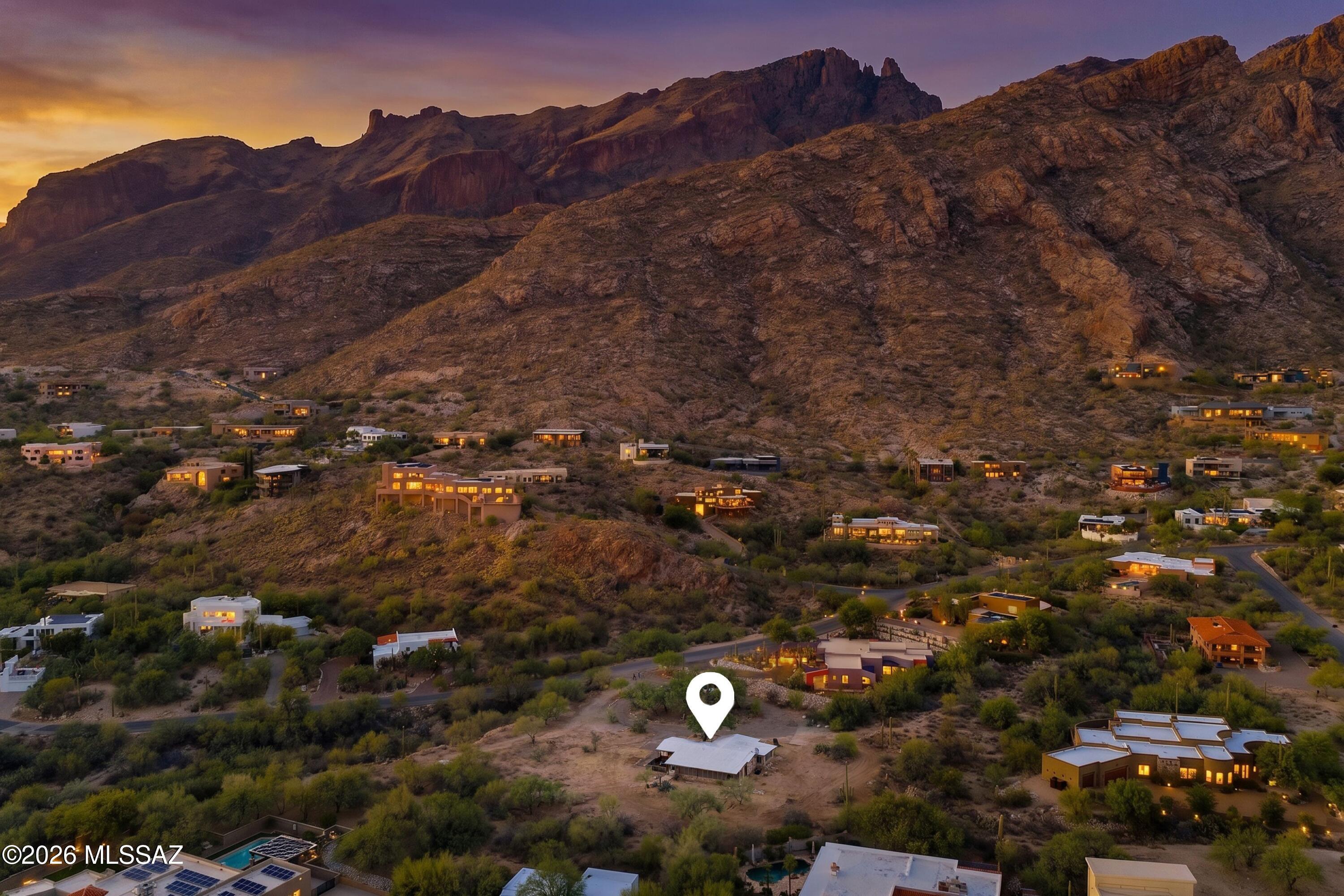 Rare Land. Real History. Dream Home Ready. A piece of Tucson history and the opportunity of a lifetime. This 1.46~acre lot in the Coronado Foothills Estates subdivision in the coveted Catalina Foothills was the original cook shack for the Pontatoc Mine described by the Arizona Daily Star in 1906 as ''an immense copper bonanza.'' The mine shaft sits just 100' to the North, and the road to the property was built by the mine owners themselves to haul ore by mule wagon to the Tucson Railroad Depot. When the mine closed in 1918, the Pontatoc Mine Engineer bought the land and the surrounding 116 acres, choosing this lot as his own. That legacy passed through just two families over the next century and now can be yours. Approved plans for a one-of-a kind custom home are already in hand.  The lot flat, buildable, and perfectly positioned, tucked near the base of the Santa Catalina Mountains, with breathtaking sunrise, sunset, mountain and city views stretching across the valley. Towering Saguaros, ancient Mesquite trees and mature Palo Verdes create a landscape that feels untouched, giving the property a quiet, serene beauty that is increasingly rare in today's Tucson. You'll feel miles away from it all, yet you're just minutes from Skyline Country Club, La Paloma, La Encantada, and the best dining and shopping Tucson has to offer. Room for a pool, guest house and more. This is not a lot, it is a legacy waiting for its next chapter.