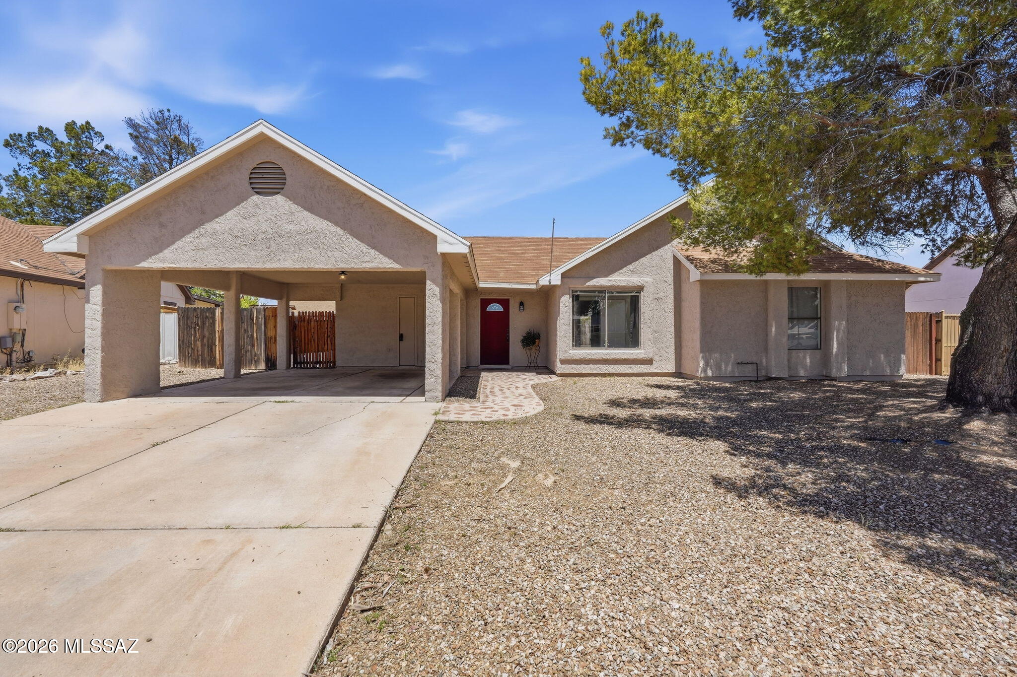 Welcome to this charming 4-bedroom home in a quiet Southwest Tucson neighborhood. Featuring tile flooring in the main living areas, cozy carpeted bedrooms, and a bright kitchen, this home is ready for its next owner. Enjoy peace of mind with a newer A/C system, replaced water heater, and newer rear windows. The spacious backyard offers endless possibilities for entertaining, gardening, or a future pool. Conveniently located near schools, parks, shopping, and I-19.