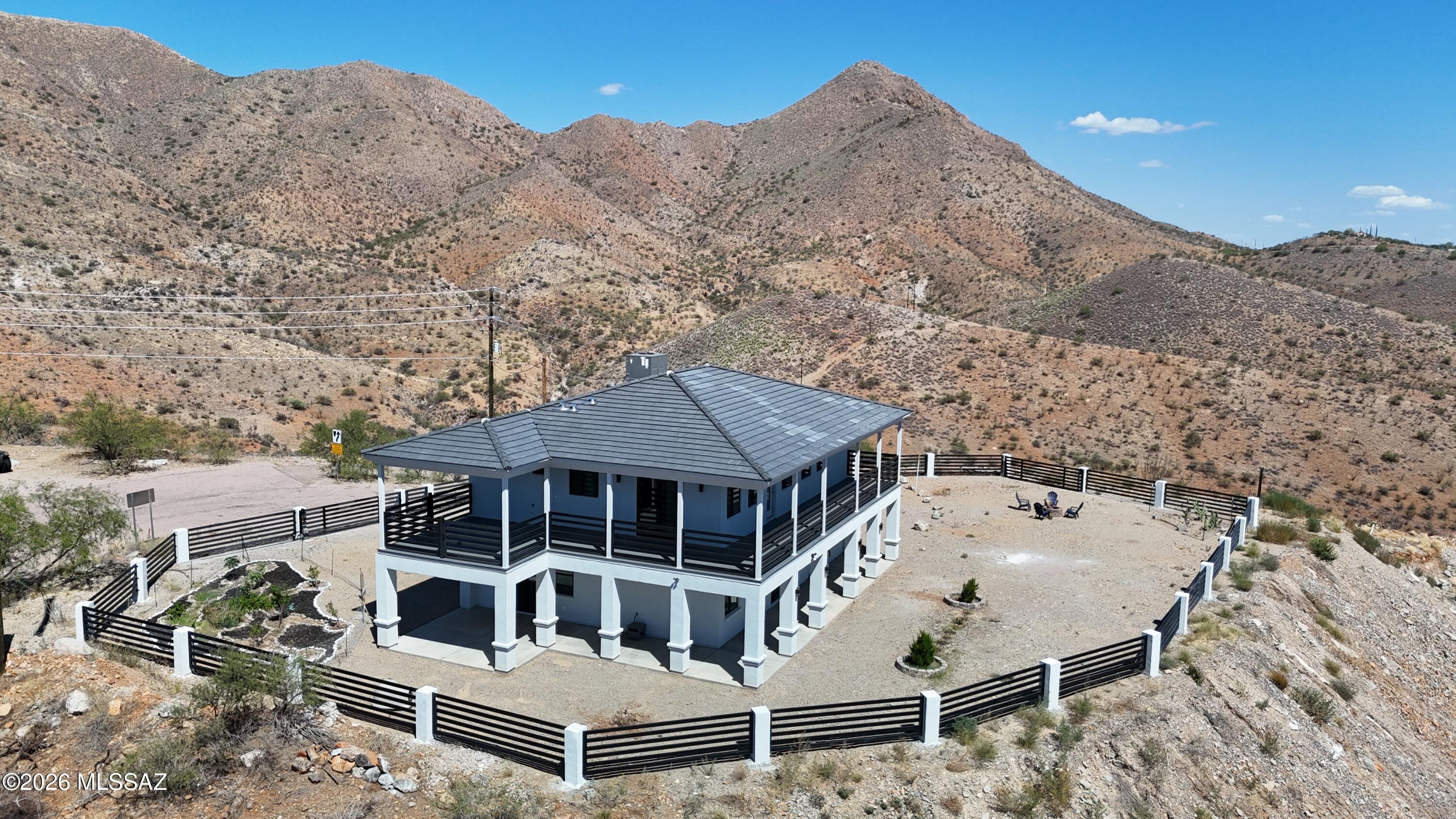 This spectacular 2,870 sq. ft., 2-story home in Rio Rico, AZ, sits on 1.99 acres. It features a gourmet kitchen with upscale appliances, quartz countertops, and a 4-person island. The upper level includes a coffee station and three bedrooms, while the master suite offers sliding doors framing expansive area views.
Living area bright and open living room that flows seamlessly into the dining space. Primary Kitchen
features upscale appliance including an electric range, 5- burner commercial stove,dishwasher, microwave and refrigerator. Island & countertops gorgeous quartz countertops complete with a spacious island that comfortably seats 4 people.
all electric FOR RENT water include