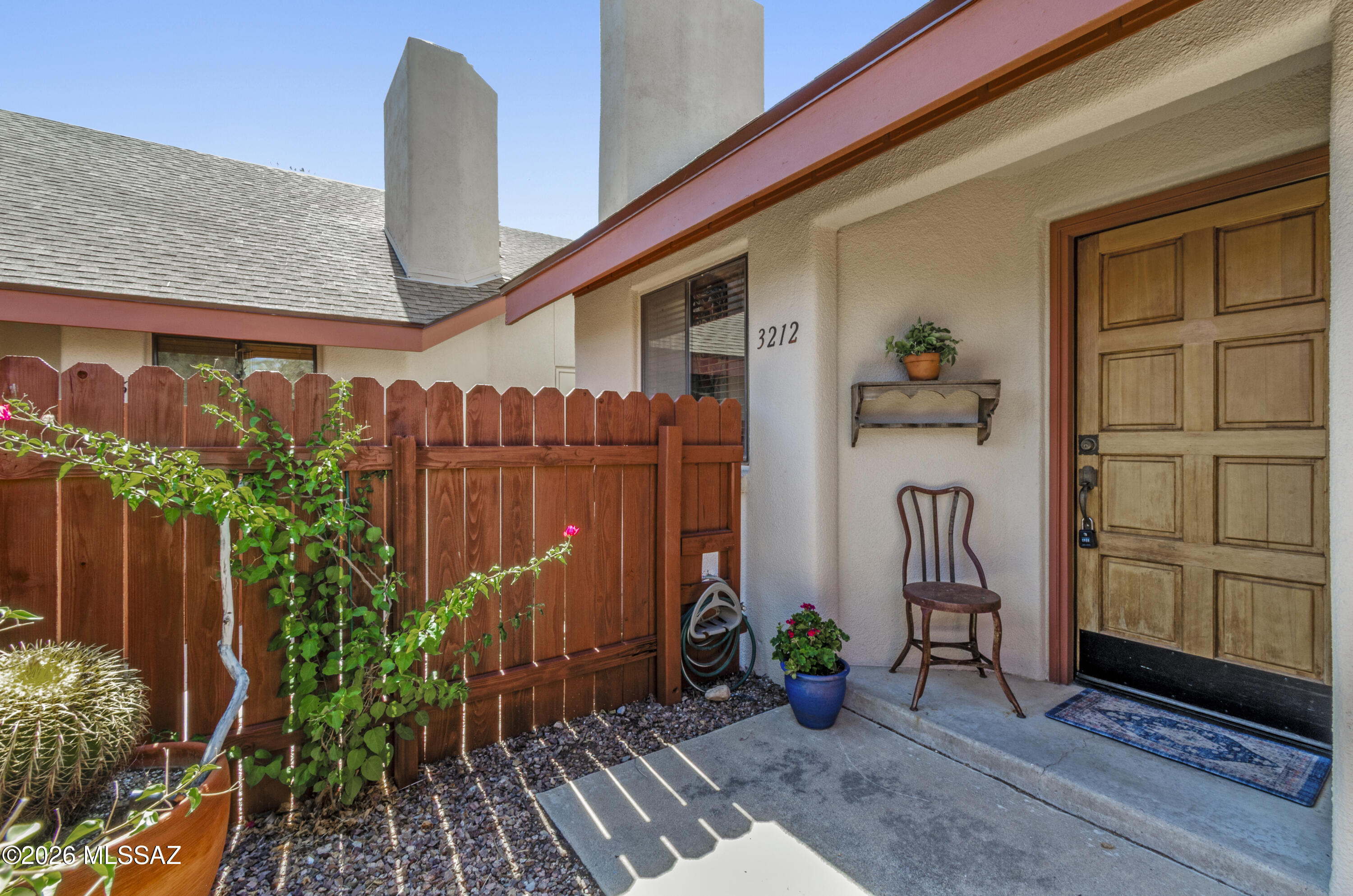 Freshly painted and filled with natural light, this inviting home features vaulted ceilings, bathroom skylights, and a cozy fireplace that creates a warm and welcoming atmosphere. The thoughtful layout offers bright, open living spaces and a private patio just off the primary bedroom, providing the perfect place to relax and enjoy Tucson's beautiful weather.

Located in a quiet community of only seven units, this home offers a rare combination of privacy and convenience. Just one mile from the University of Arizona campus and around the corner from the 3rd Street Bike Path, Whole Foods, Starbucks, La Rosa's, and numerous local restaurants and amenities, you'll enjoy the best of central Tucson living. A wonderful opportunity to own a bright, low-maintenance home in an ideal location.