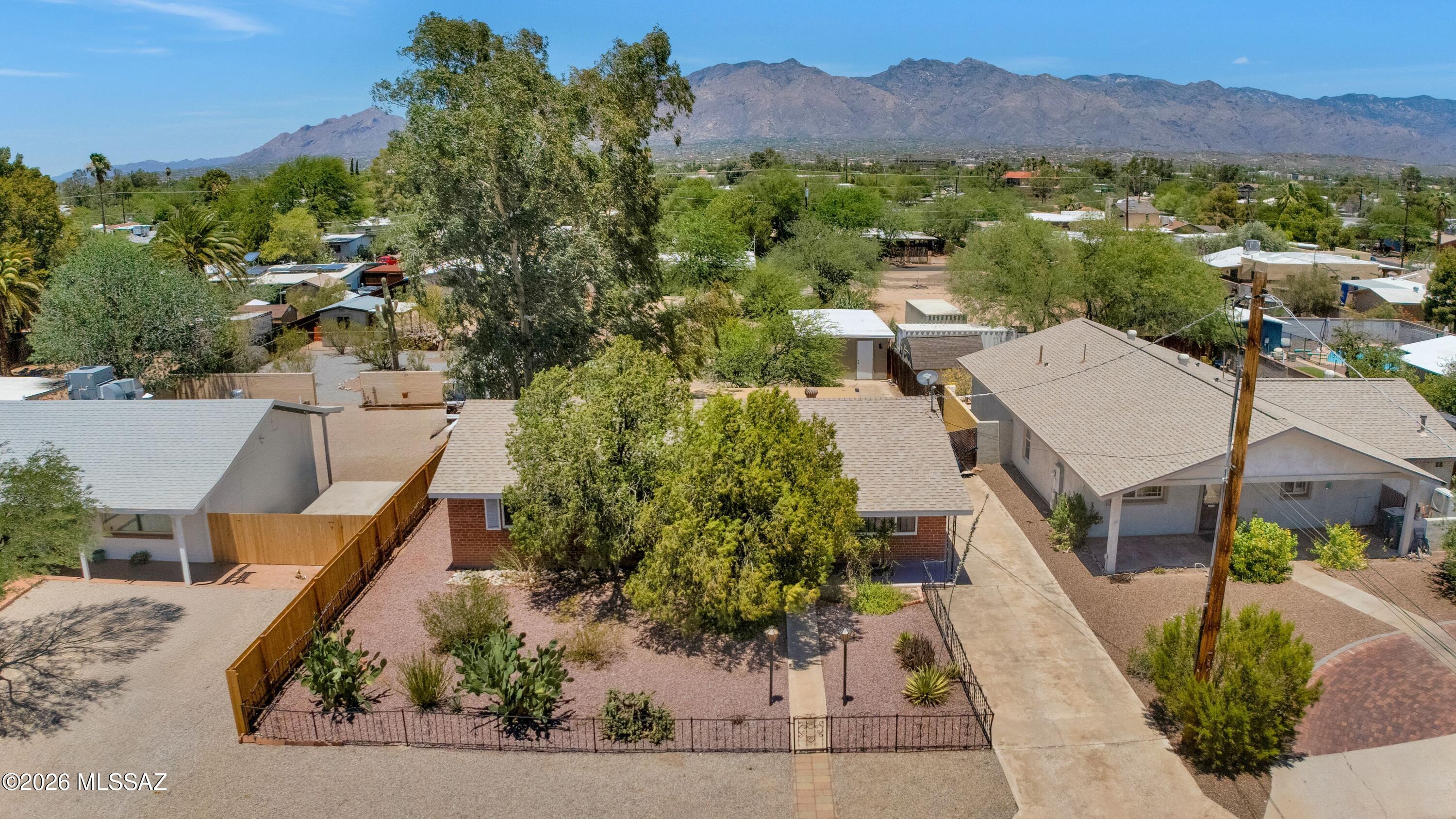 Charming mid-century brick home in the heart of central Tucson! This 3-bedroom, 1-bath property sits on a generous 9,500+ sq ft lot with no HOA, offering plenty of space for outdoor living, gardening, expansion, or a potential ADU, subject to zoning and permitting. Inside, the home features practical updates including newer HVAC, replumbing completed in 2017, a refrigerator approximately one year old, and a dishwasher approximately two months old. The detached storage shed/workshop provides valuable extra space and may offer potential for conversion to a one-car garage, studio, hobby space, or other use. A sweet property with character, flexibility, and a convenient central Tucson location close to shopping, dining, schools, parks, and major corridors.