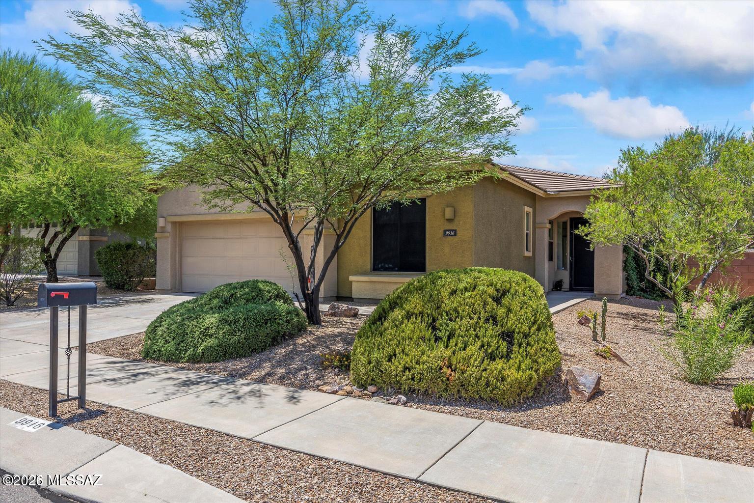 Beautiful family home in quiet eastside neighborhood, close to everything!  3 BRs, + office/den, 2 Baths and 8 ft. oversized doors for a spacious feel. Main ensuite bath has a curbless shower and a large walk-in closet with built-in shelves.  2 guest bedrooms share a bathroom with 2 sinks.  The laundry room has built-in shelves/cabinet, and folding area. Carpet, Travertine LVP floors thruout.  The home includes a custom entertainment bar with 2 built-in fridges.  Home has water softener system, and solar!  3 car tandem garage. There is a ramada out back plus fruit trees and an electric patio shade. Desert Enclave is a desirable, Eastside subdivision close to shopping, schools and restaurants.