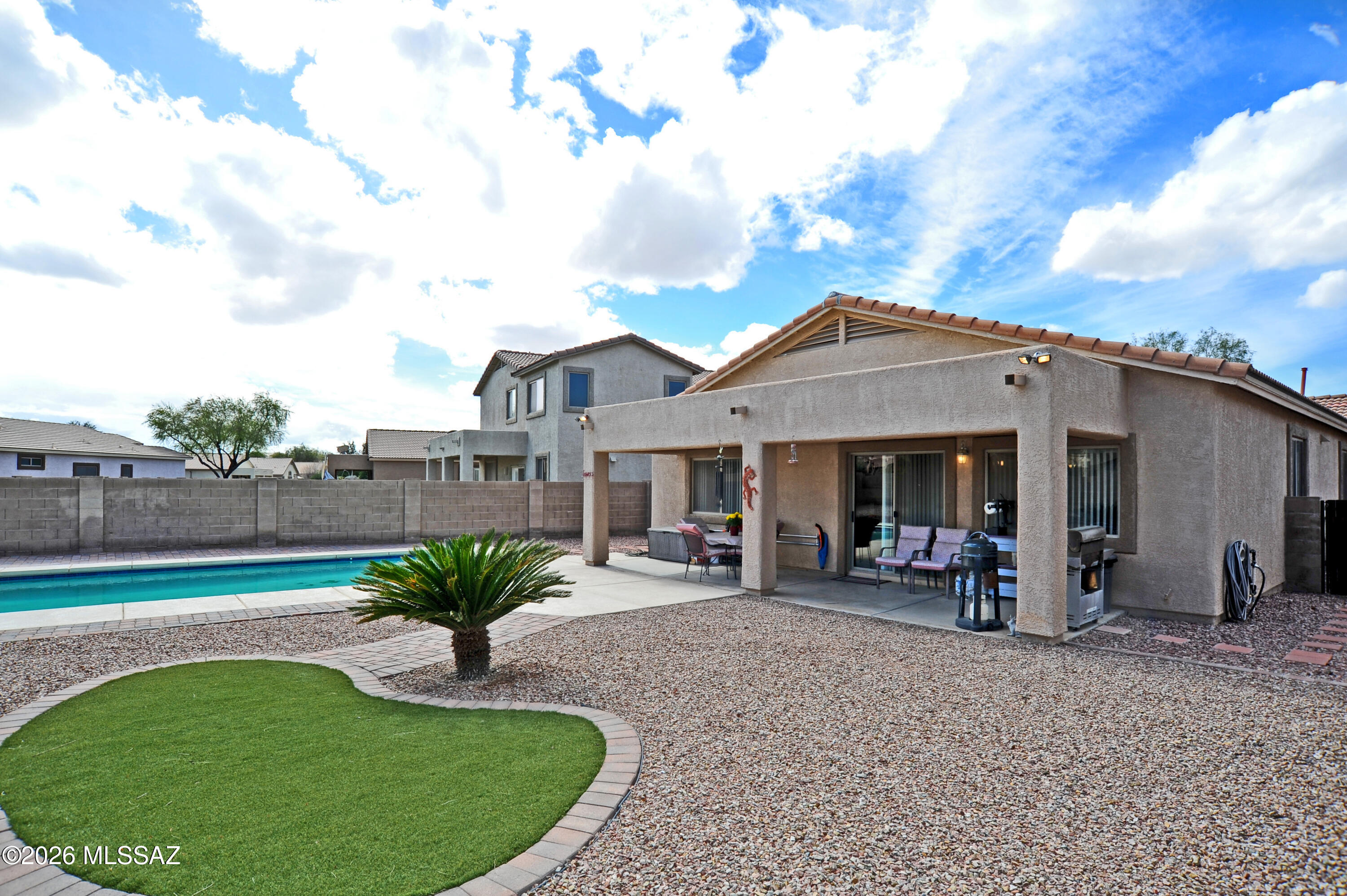 Welcome to your sanctuary in the heart of Marana! This charming single-family home  offers a perfect blend of comfort, style, and community living.
Located in the highly sought-after Gladden Farms community, this  contemporary residence is designed for modern lifestyles. Built in 2006, the home features an open-concept layout that maximizes space and natural light.
Spacious Living: 3 Bedrooms and 2 Bathrooms, including a large primary suite with a walk-in closet.
Features a large pantry, ample cabinet space, and upgraded countertops--perfect for home chefs.
An open great room concept , flowing seamlessly toward the outdoor space. Beautiful large pool. The backyard boasts a covered patio, lush landscaping, and plenty of side-yard space for activities. Living in Gladden Farms means more than just a beautiful home; it's a lifestyle. Residents enjoy:
Access to community parks, lighted basketball and sport courts, and scenic jogging/bike paths.
Proximity to top-rated schools like Gladden Farms Elementary (just 0.2 miles away) and Marana High School.
A well-maintained neighborhood This property is ideal for those seeking a quiet suburban feel with easy access to I-10, making commutes to Tucson or Phoenix a breeze.