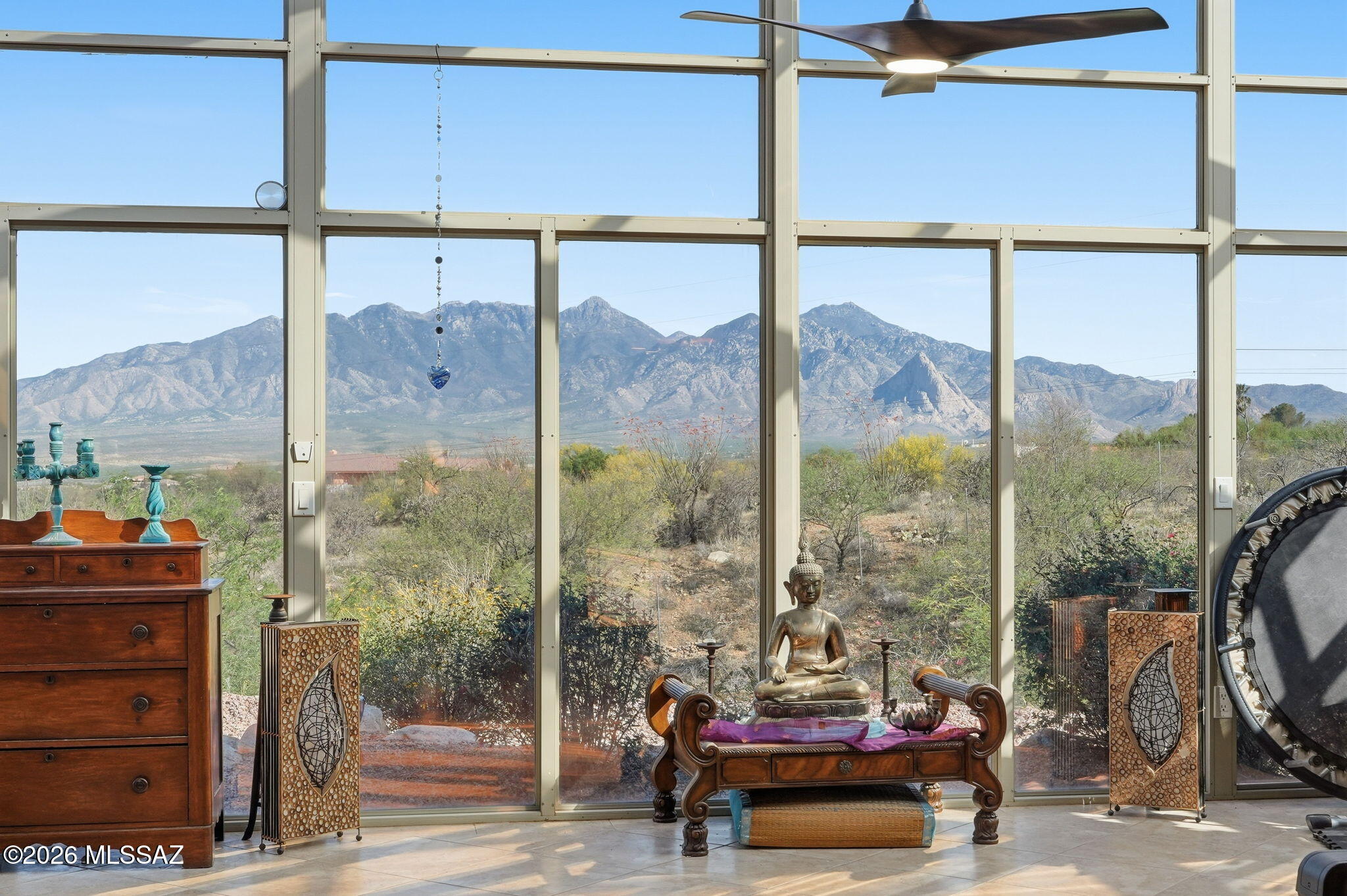 Gated, private, & fully updated--this exceptional 3-bedroom, 2.5-bath 2x6 construction custom home offers 2,890 sqft on 4.75 serene acres with sweeping Santa Rita Mountain views & no HOA. Inside, you'll find thoughtful custom upgrades throughout, including a spa-inspired primary suite, beautifully renovated bathrooms, fresh interior & exterior paint, and new windows. The stunning sunroom is a true highlight, capturing panoramic desert & mountain views in every direction. Need space to work or expand? The impressive 30x50 warehouse offers endless possibilities--perfect for a home business, workshop, or storage. With nearly 5 acres, there's also room to build a second home without sacrificing those breathtaking views. Enjoy the freedom of no HOA restrictions, just wide-open desert, mountain views in every direction. Need space to work or expand? The impressive 30x50 warehouse offers endless possibilities--perfect for a home business, workshop, or storage. With nearly 5 acres, there's also room to build a second home without sacrificing those breathtaking views. Enjoy the freedom of no HOA restrictions, just wide-open desert, mountain sunsets. An exceptional opportunity to own a true luxury retreat-where space, silence, & scenery elevate the art of living.