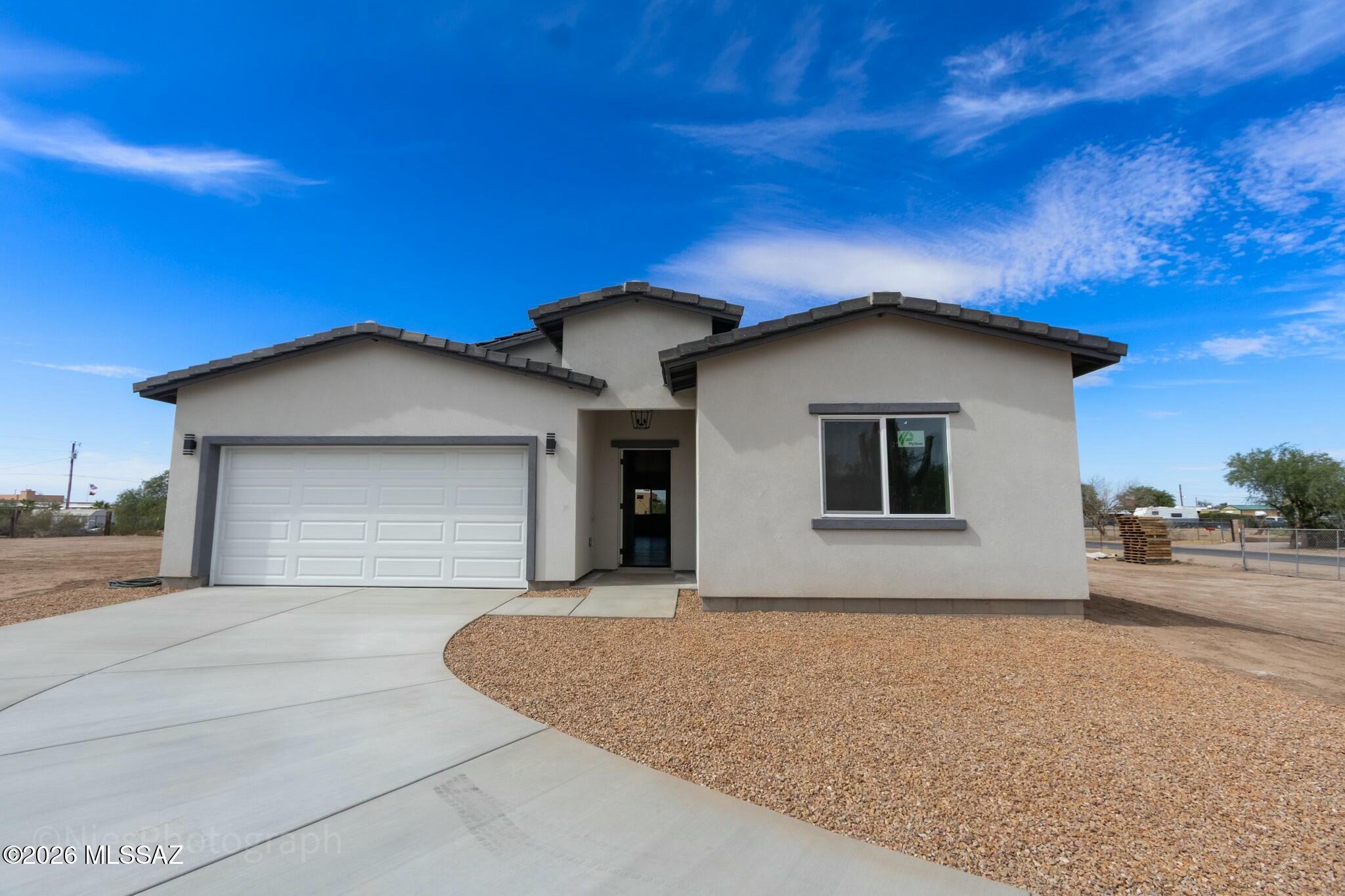 Move-in ready new construction on a full one-acre corner lot in Marana with no HOA. This beautiful home features 4 bedrooms, an office, 2.5 bathrooms, and a modern open-concept layout with quality finishes throughout.
Enjoy plenty of space for horses, trailers, RVs, and more, all on a paved road in a quiet location close to town.
USDA financing is available for eligible buyers. Buyers who use the preferred lender may also qualify for a 1-year rate buydown on FHA or Conventional financing.
Preferred Lender: Matthew Labozetta, Guild Mortgage | 520-631-6920
Seller concessions available.