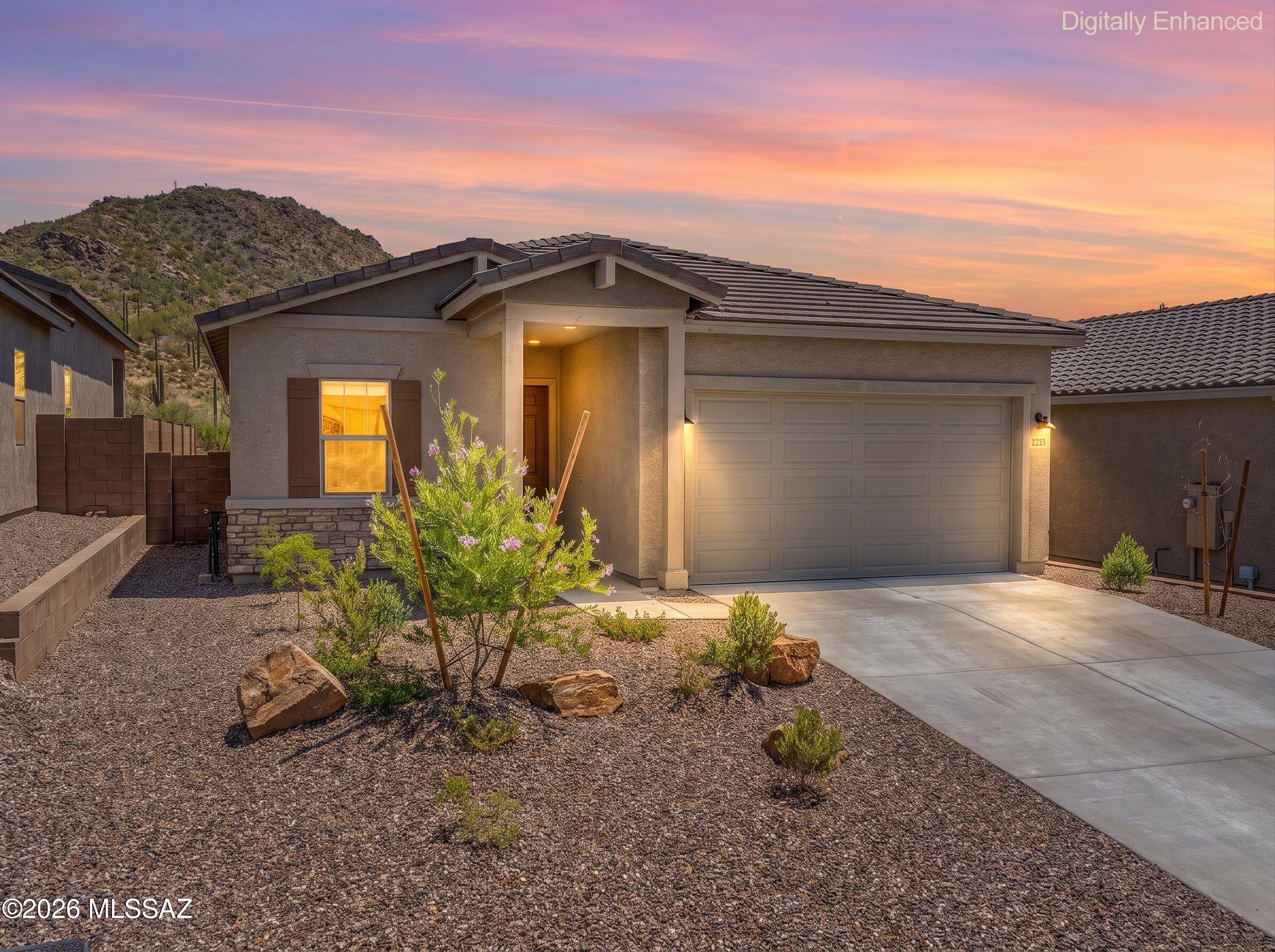 Welcome home to this beautifully maintained Brandy model with Ranch elevation, located in the desirable gated community of Saguaro Reserve II in Dove Mountain. This 2-bedroom, 2-bath home with a den offers 1,735 square feet of thoughtfully designed living space featuring an open-concept floor plan that's perfect for both everyday living and entertaining. The chef's kitchen showcases beautiful granite countertops, rich dark wood cabinetry, a large island with sink and breakfast bar, stainless steel appliances, and a spacious walk-in pantry. The inviting great room flows seamlessly into the dining area, creating a bright and welcoming atmosphere. The spacious primary suite features a large walk-in closet, dual vanities, and an oversized walk-in shower. Double doors lead to the versatile..... ....den, making it an ideal home office, media room, or flex space. The generously sized guest bedroom is conveniently located next to the guest bath with a tub/shower combination. Step outside to enjoy the private backyard with breathtaking Tortolita Mountain views, a covered patio, and newly installed landscaping with decorative rock, creating the perfect setting to relax and enjoy Arizona's beautiful sunset