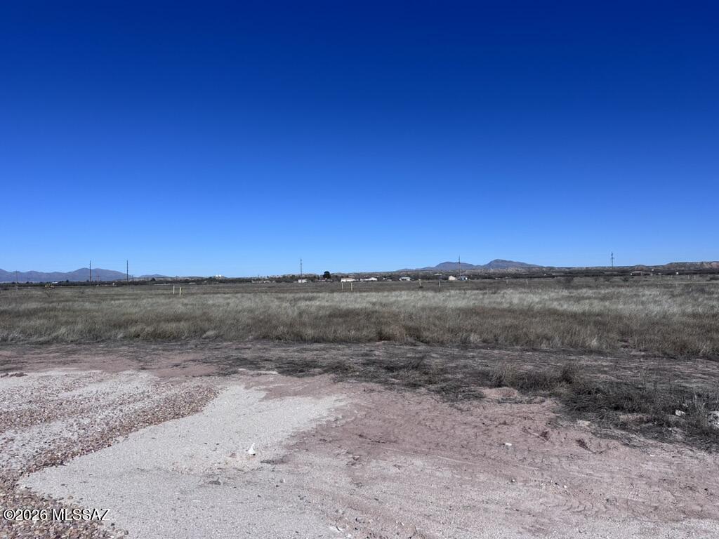 *LOT D* Rare opportunity to own acreage in the quiet Pomerene area, offering excellent potential for custom home construction or a small builder/investment project. These five lots are located on a developed cul-de-sac just off Colony Road, providing privacy, functionality, and an efficient layout. Electric and water are available to the lot lines, reducing upfront development costs. Access is provided by a gravel road, and a new survey has been completed. Tax records currently reflect the original parcel and do not yet show the recent lot configuration. Whether you are looking to build a thoughtfully designed custom home or capitalize on a multi-lot opportunity for future homes, this property offers flexibility, open space, and peaceful rural surroundings with convenient access to town.