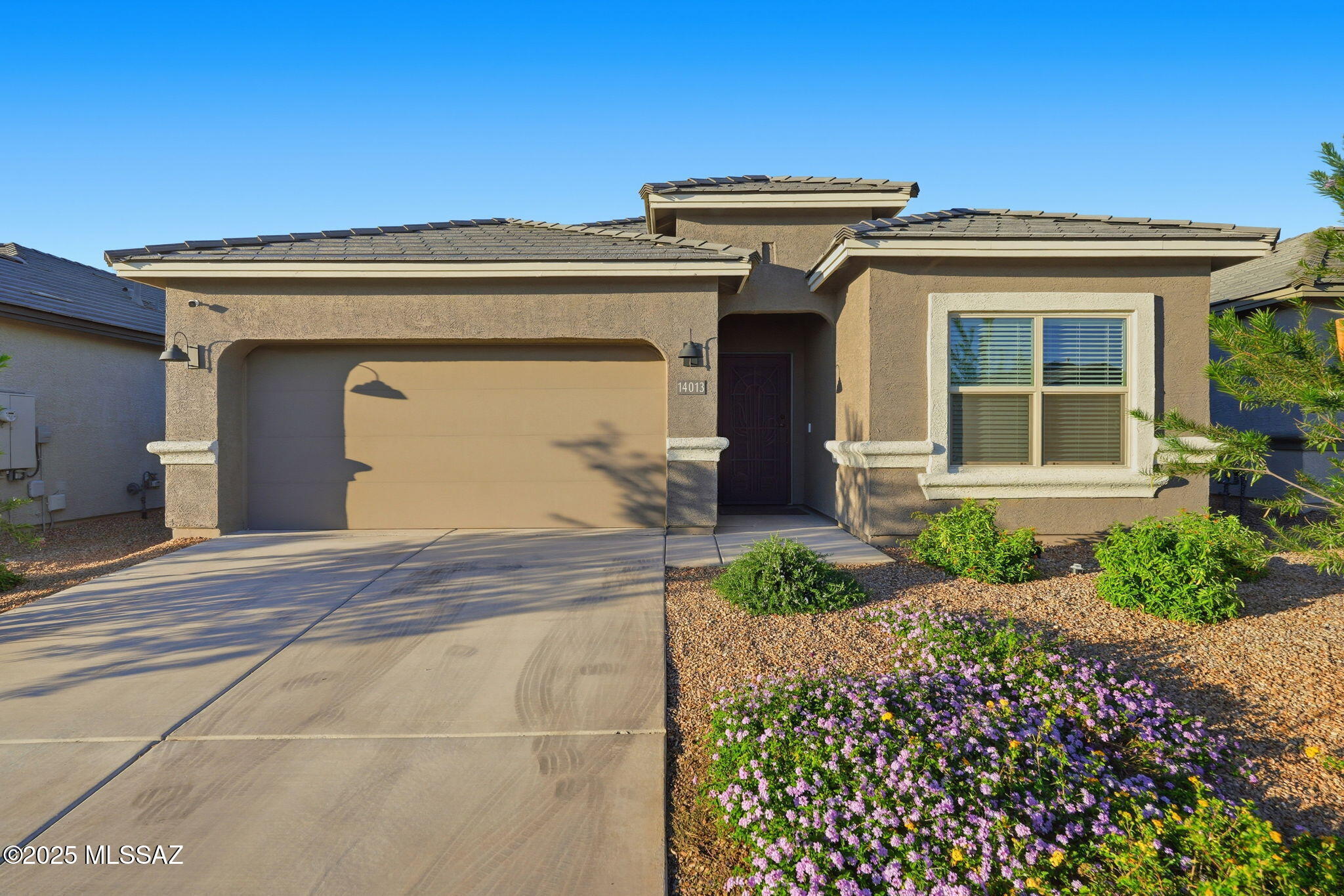 Beautifully upgraded home in the heart of the Rocking K community! This 1,815 sq ft single-story home is fully enhanced with luxurious finishes and solar for energy efficiency. Open-concept living features 9-ft ceilings, quartz countertops, white cabinetry, stainless steel appliances, and a designer kitchen backsplash. Upgrades include professional paint, custom accent walls, and elegant ''his & hers'' cabinetry in the primary bath. Step into the backyard and enjoy a private retreat with lush turf, pavers, a covered patio, and stunning mountain views. Highlights include an elegant Ironworks front door, epoxy garage floor, and water softener. Unlike new construction, everything is complete--just move in and start living your dream. Welcome Home.