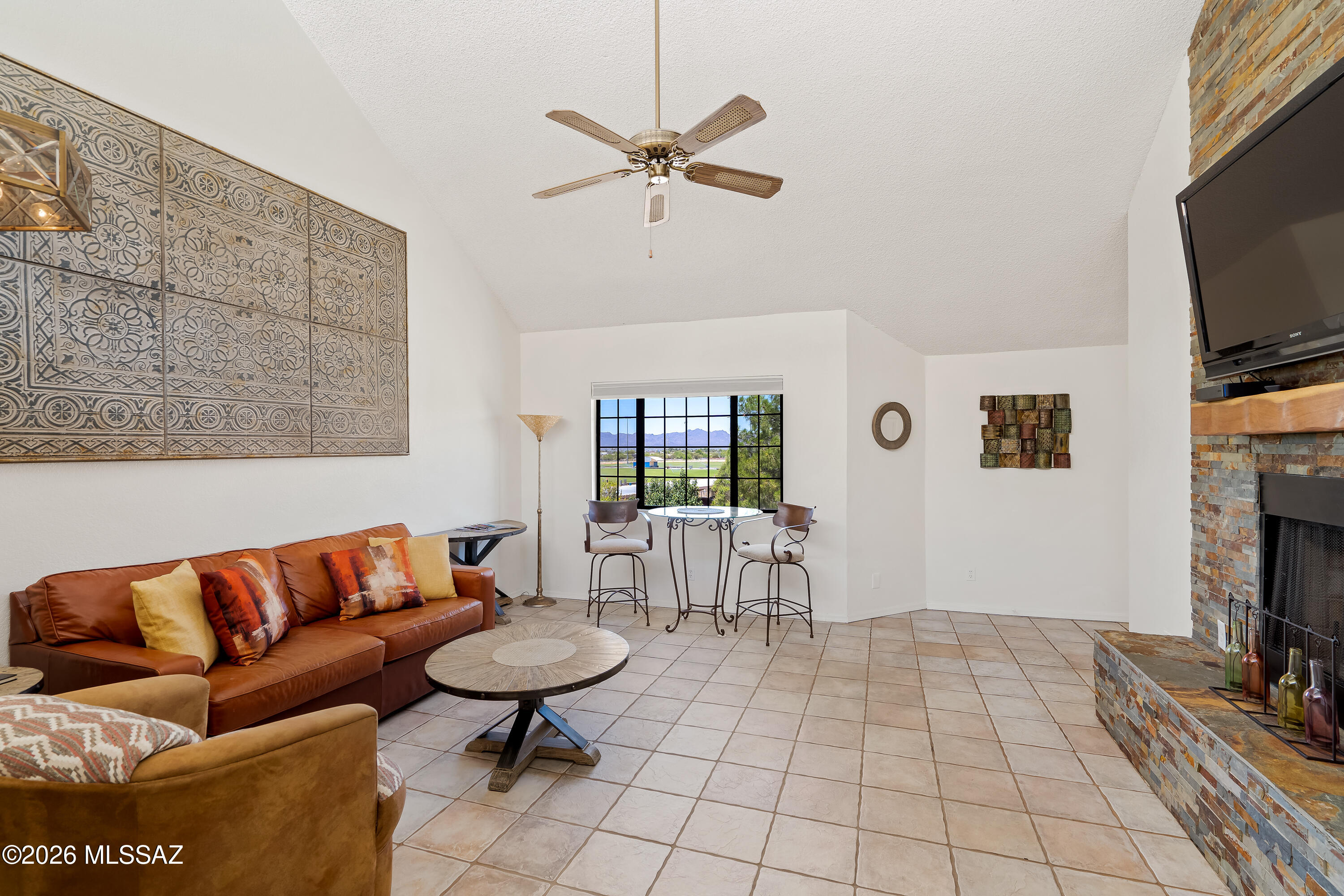 FOOTHILLS GEM! GREAT RENTAL OPPORTUNITY OR ENJOY IT YOURSELF! Experience resort-style living in this move-in ready, FULLY FURNISHED 1-bedroom, 1-bath condominium offering 753 square feet of comfortable living space in Tucson's highly desirable Foothills area. Situated on the second floor, this inviting home features vaulted ceilings, a cozy fireplace, a utility closet, and a private balcony with views of Rillito Park and the Rillito Racetrack. Beautifully maintained and ready for immediate occupancy, this condo is ideal as a primary residence, seasonal retreat, or investment property. HOA fees cover an impressive array of amenities and services, including the roof, building exterior, pool, spa, recreation center, fitness room, racquetball court, water, sewer, and trash collection. Conveniently located near the Rillito River Park Trail, St. Philip's Plaza, popular restaurants, shopping, Trader Joe's, and Tucson Mall. Its prime location also provides easy access to the University of Arizona, making it an excellent option for students, faculty, staff, or anyone seeking a low-maintenance life
